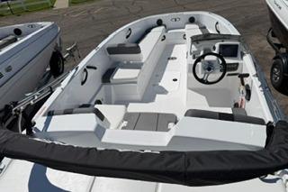 2026 Tahoe T18 boat interior with seating, steering wheel, and control panel.