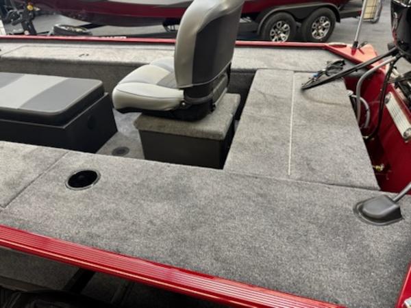 2025 Tracker Panfish 17 boat interior with seating and carpeted deck.