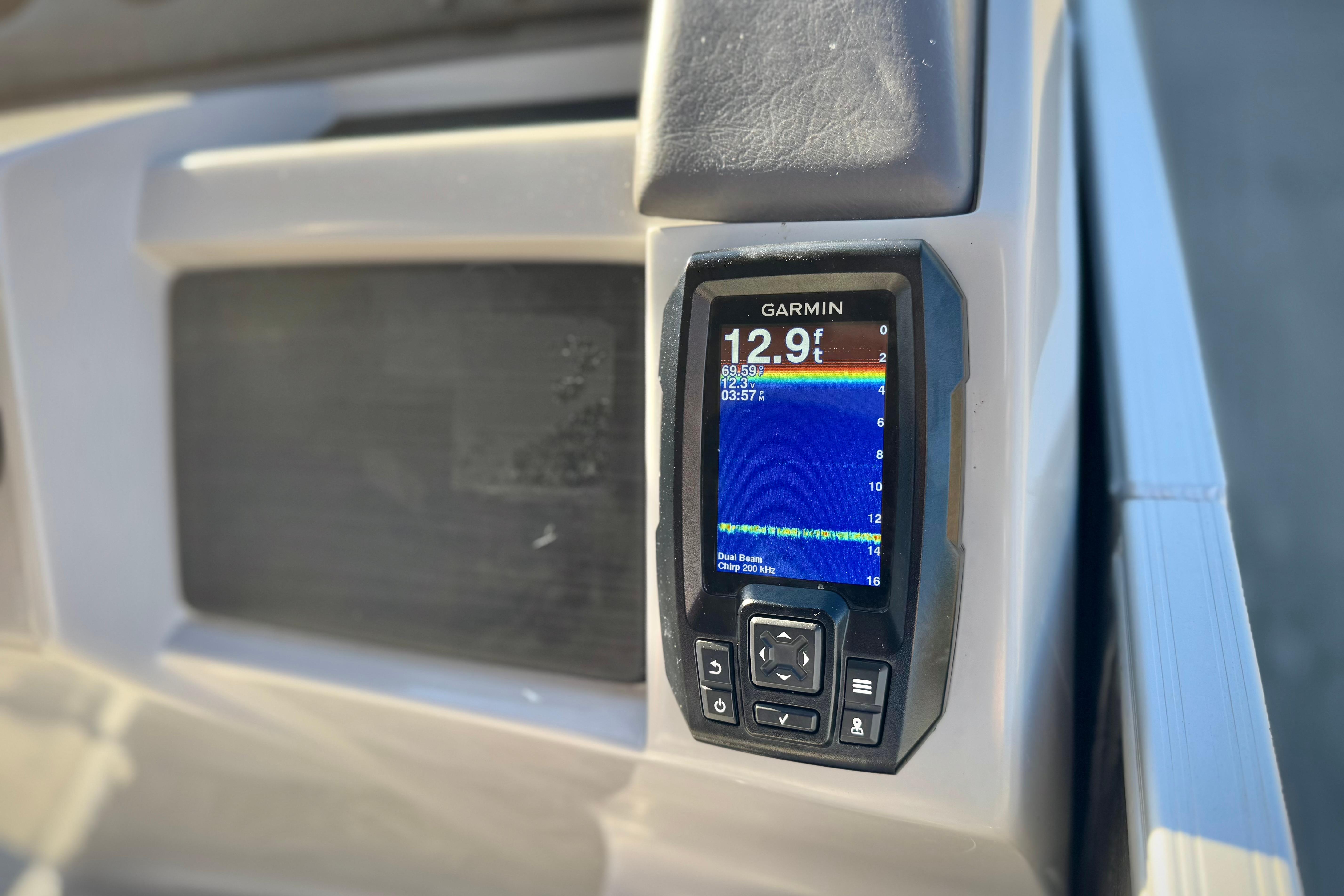 Garmin depth finder on 2021 Bennington 23LSR boat dashboard, displaying 12.9 feet.
