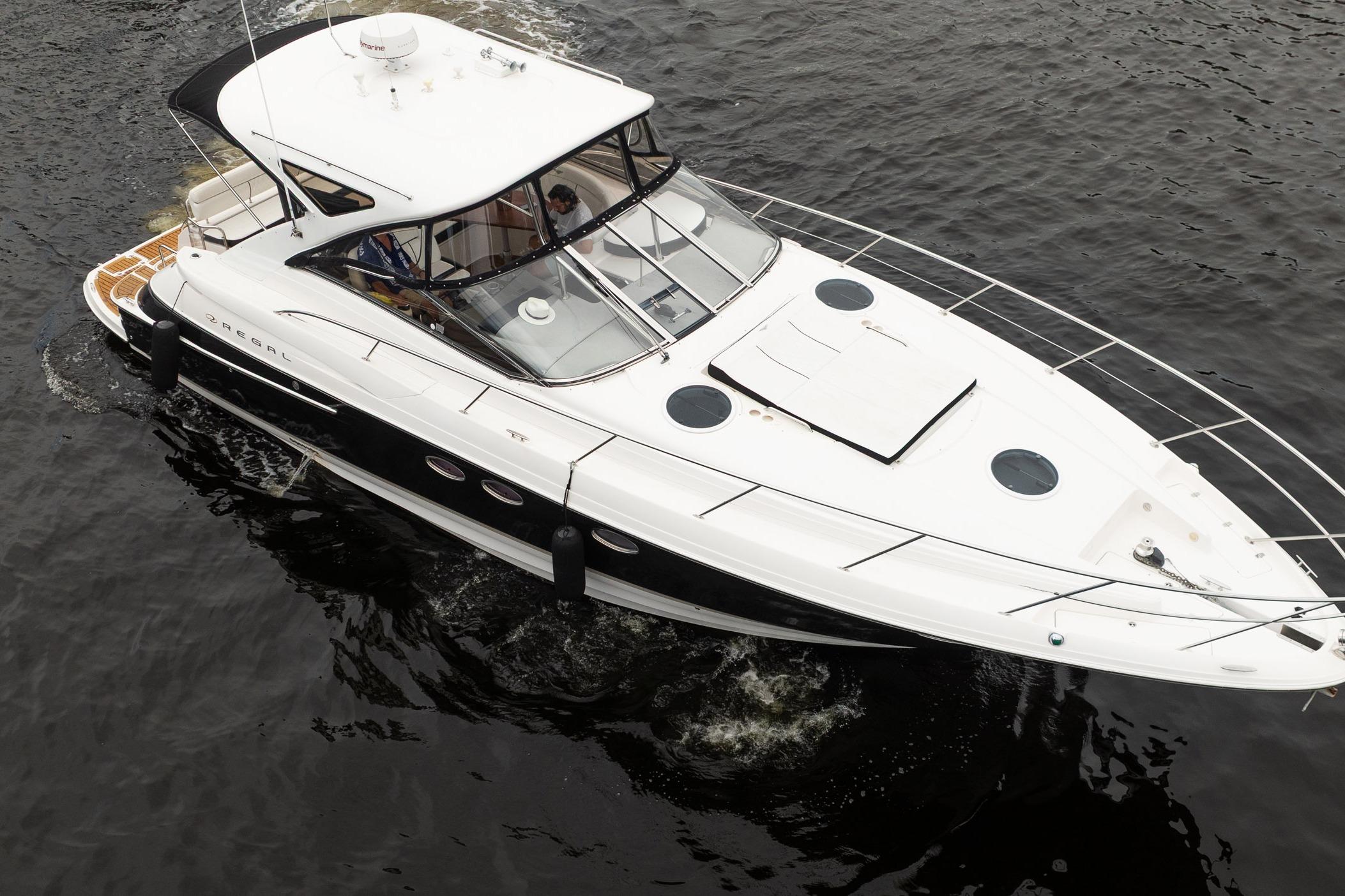 2008 Regal Commodore 4460 yacht cruising on open water, top view.