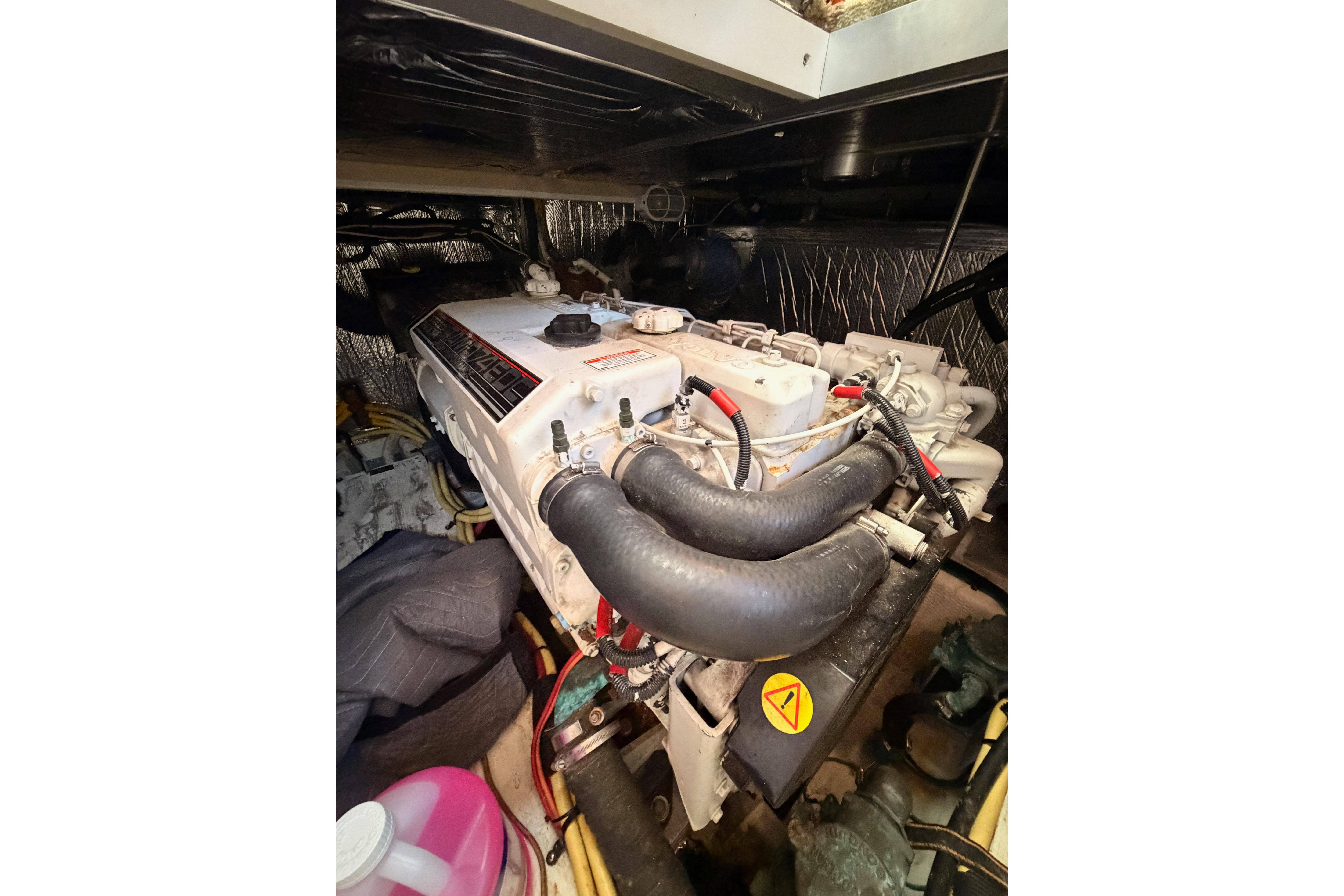 Engine compartment of a 2005 Cruisers Yachts 405 Express Motoryacht, showcasing mechanical components.