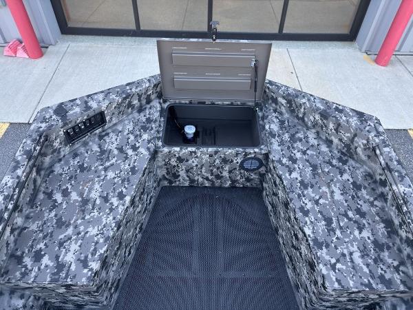 2025 Havoc 1656 VJST boat interior with camo design and open storage compartment.