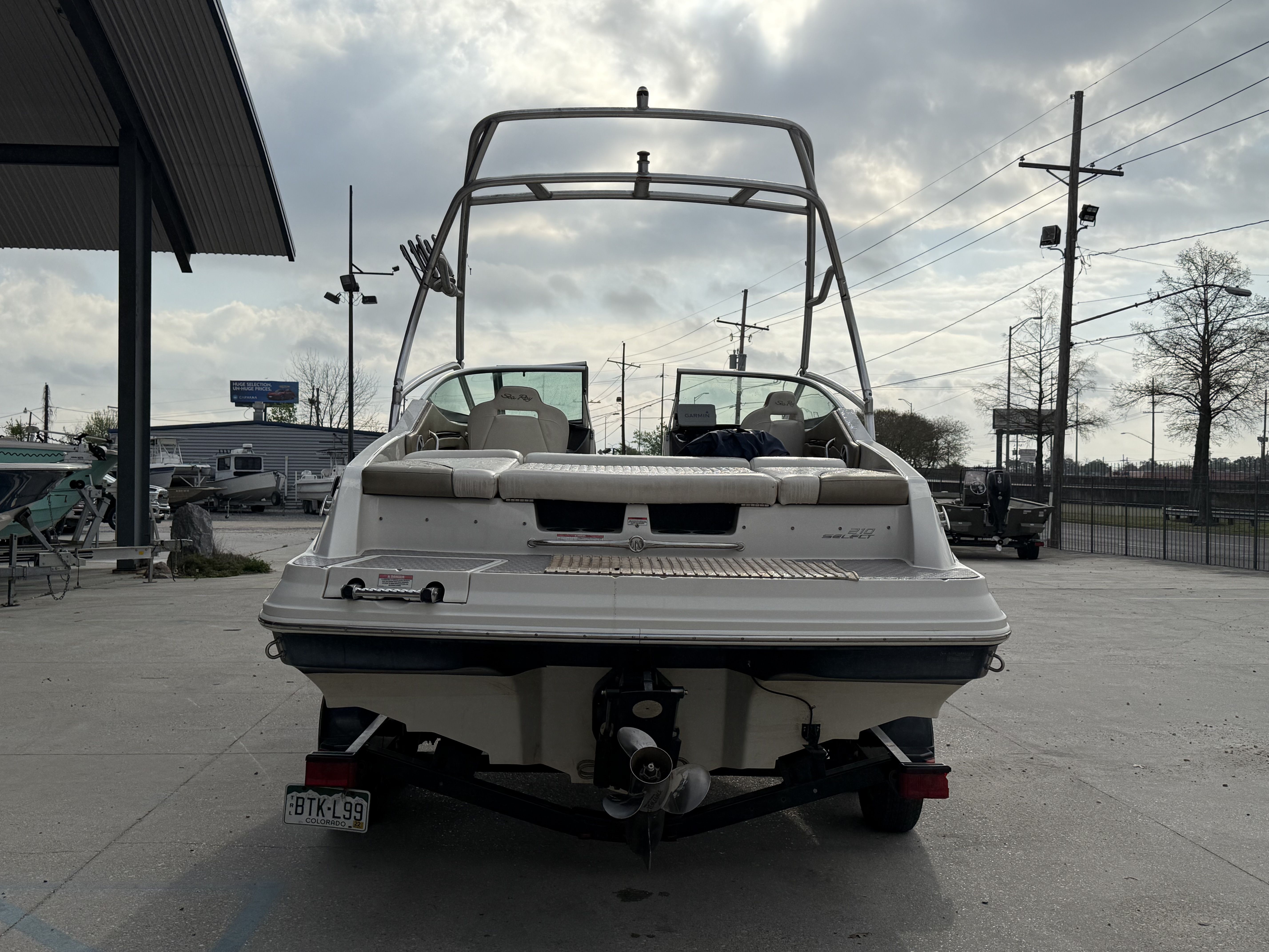 Rear view of a 2007 Sea Ray 210 boat on a trailer.