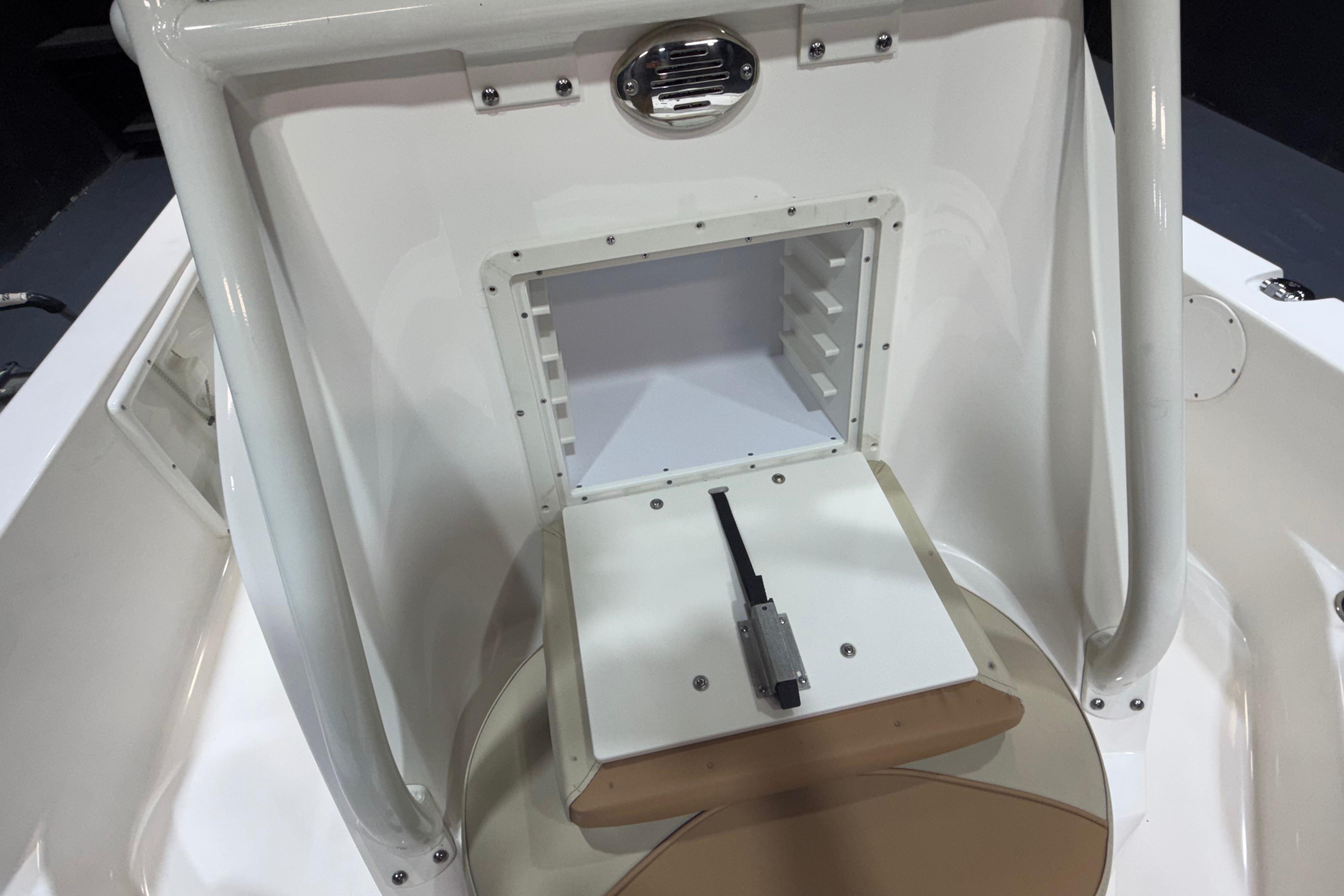 2023 NauticStar 215 XTS boat console with storage compartment and seating.