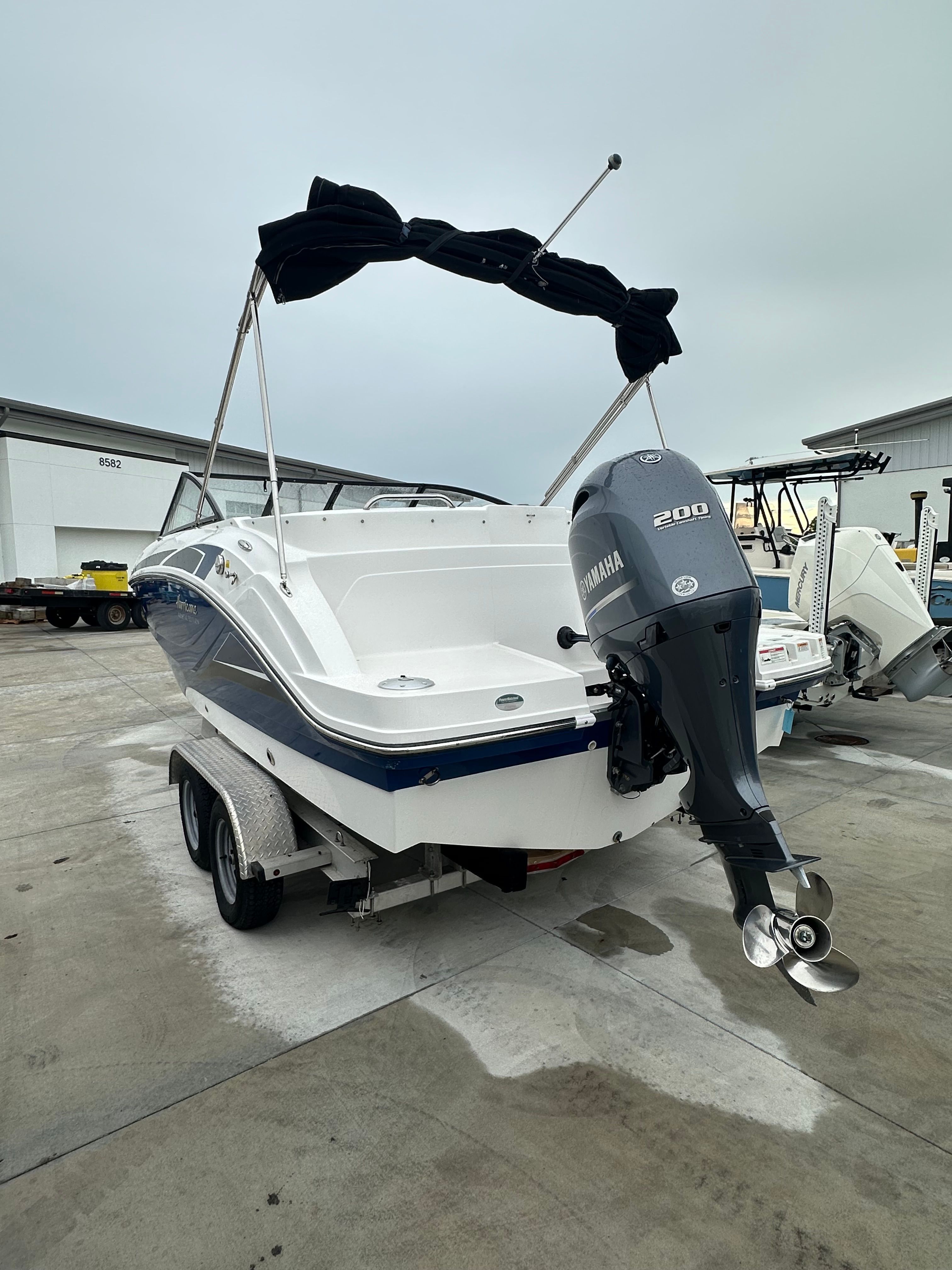 2022 Hurricane 235SD boat with Yamaha engine on trailer.