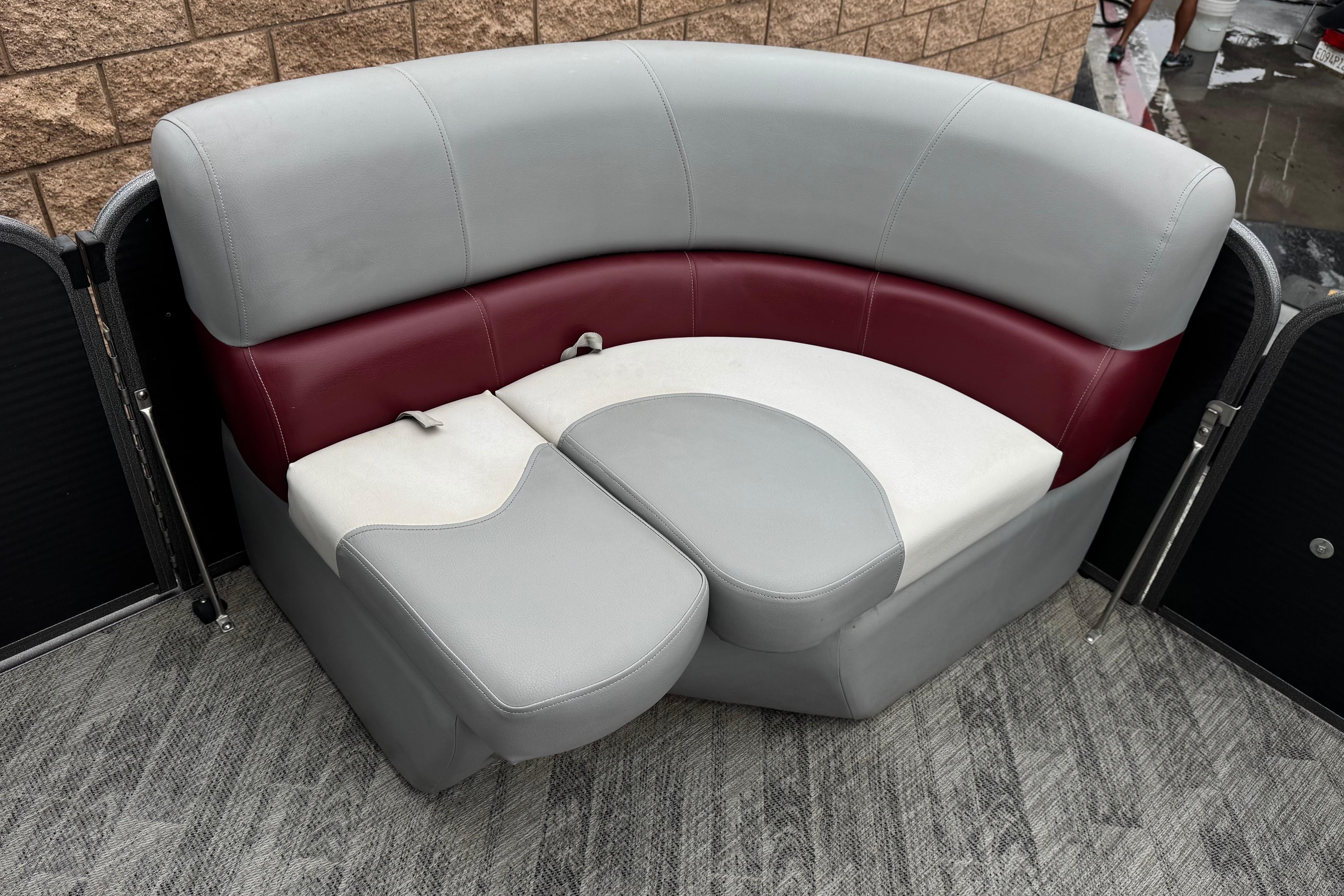 2020 Manitou 18 Aurora LE boat seating with gray and maroon upholstery.