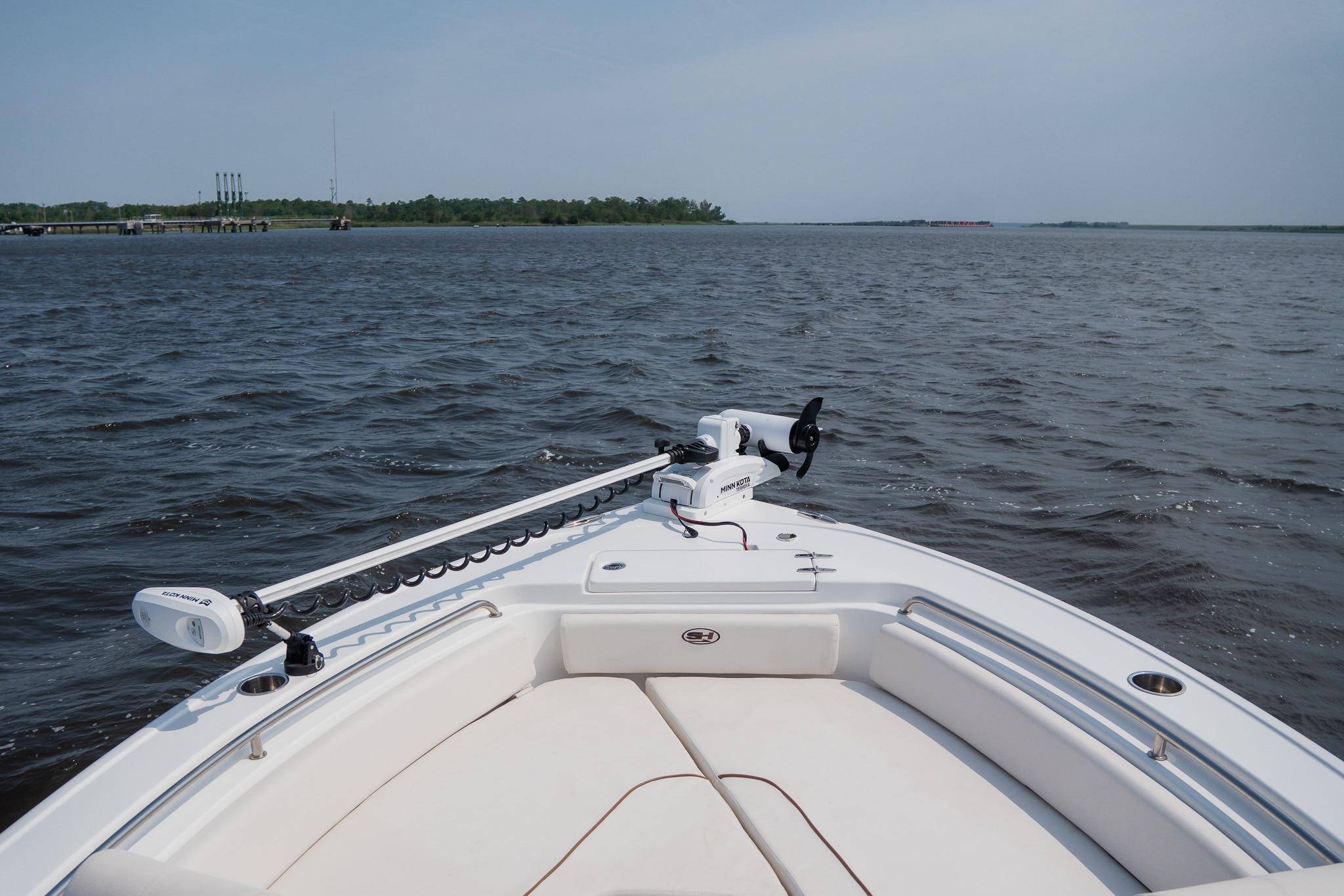 Bow view of 2022 Sea Hunt Ultra 229 boat on open water.