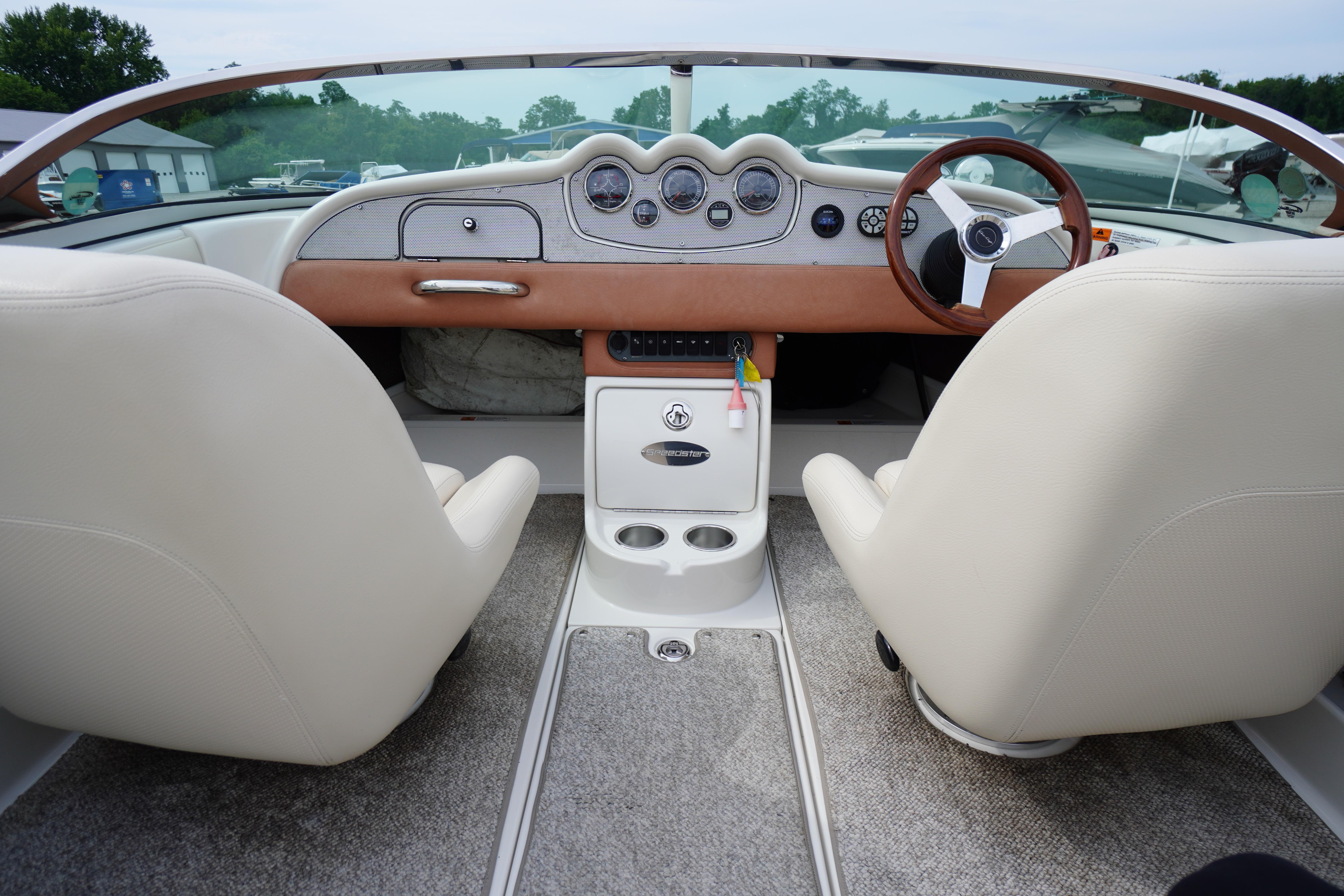 Interior view of a 2005 Chris Craft Speedster Heritage boat, featuring elegant dashboard and seating.