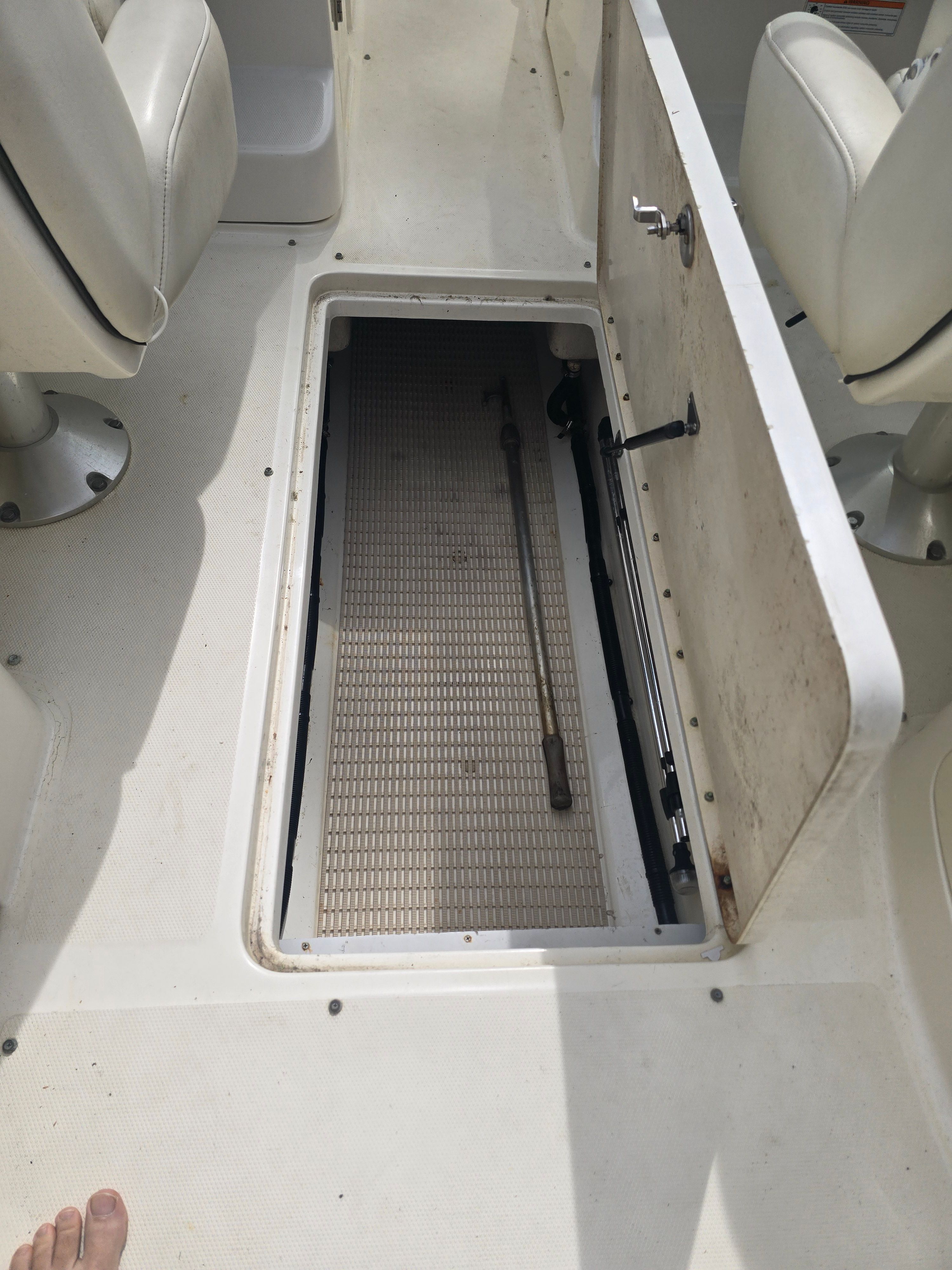 Interior of a 2007 Sea Ray 270 Select EX boat with open storage compartment.