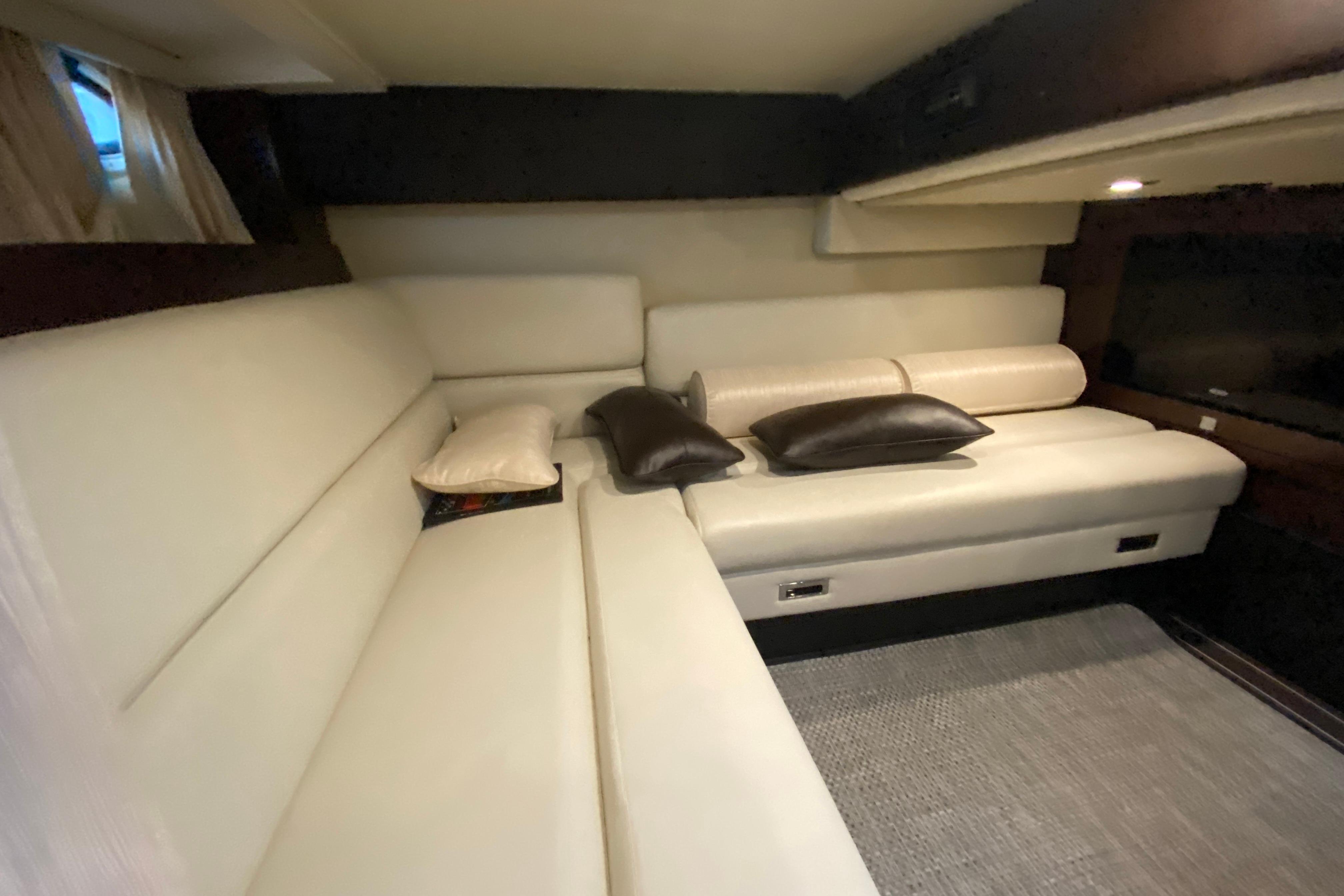 Luxurious interior of 2017 Monterey 355 Sport Yacht with plush seating and elegant decor.