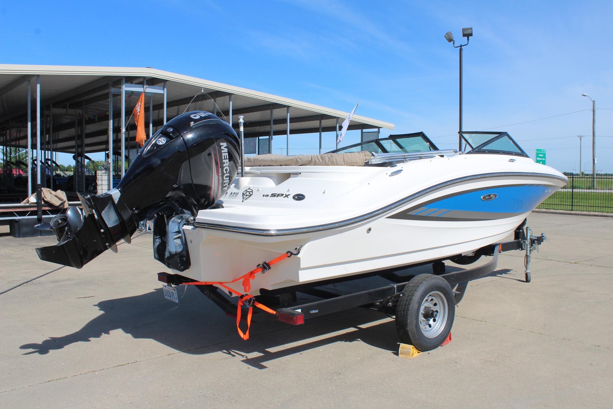 2015 Sea Ray 19 SPX OB boat on trailer, featuring a Mercury outboard motor.