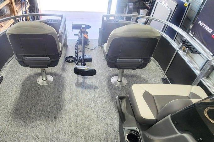 2026 Sun Tracker Bass Buggy 16 DLX interior with seating and steering console.
