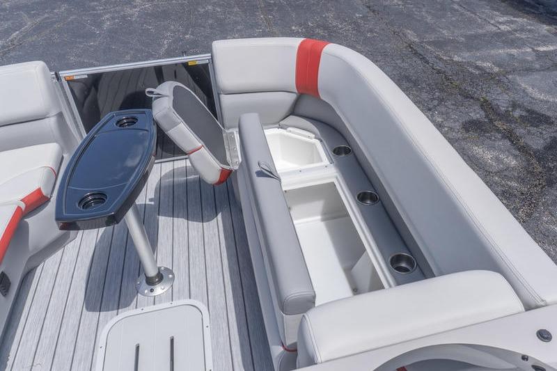 Interior of 2026 SunCatcher Select 322SL boat with seating and storage compartments.