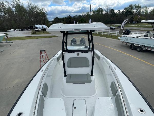 2026 Cape Horn 24XS boat, white interior, parked outdoors, overcast sky.
