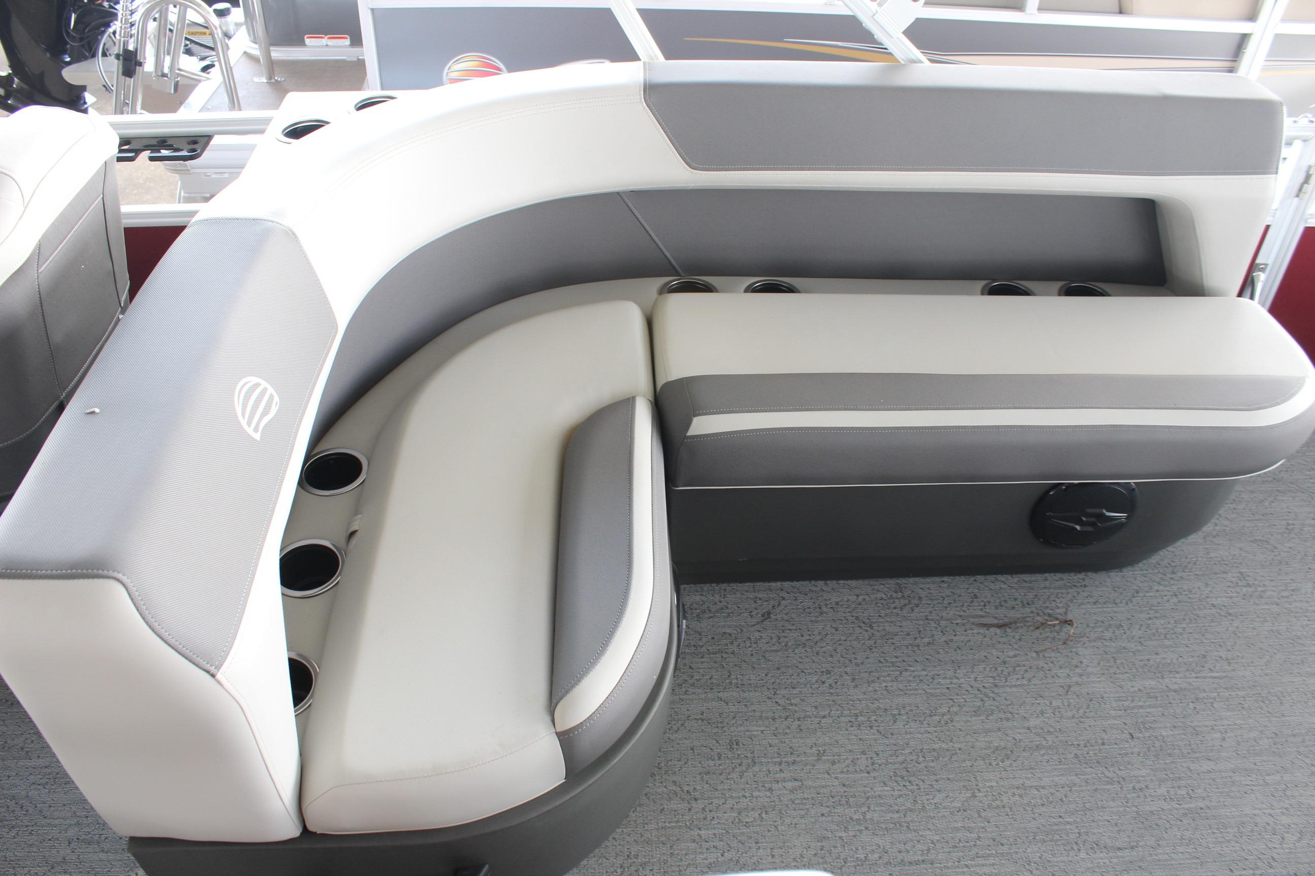 2026 Sun Tracker Bass Buggy 18 DLX boat seating with cup holders, featuring gray and white upholstery.
