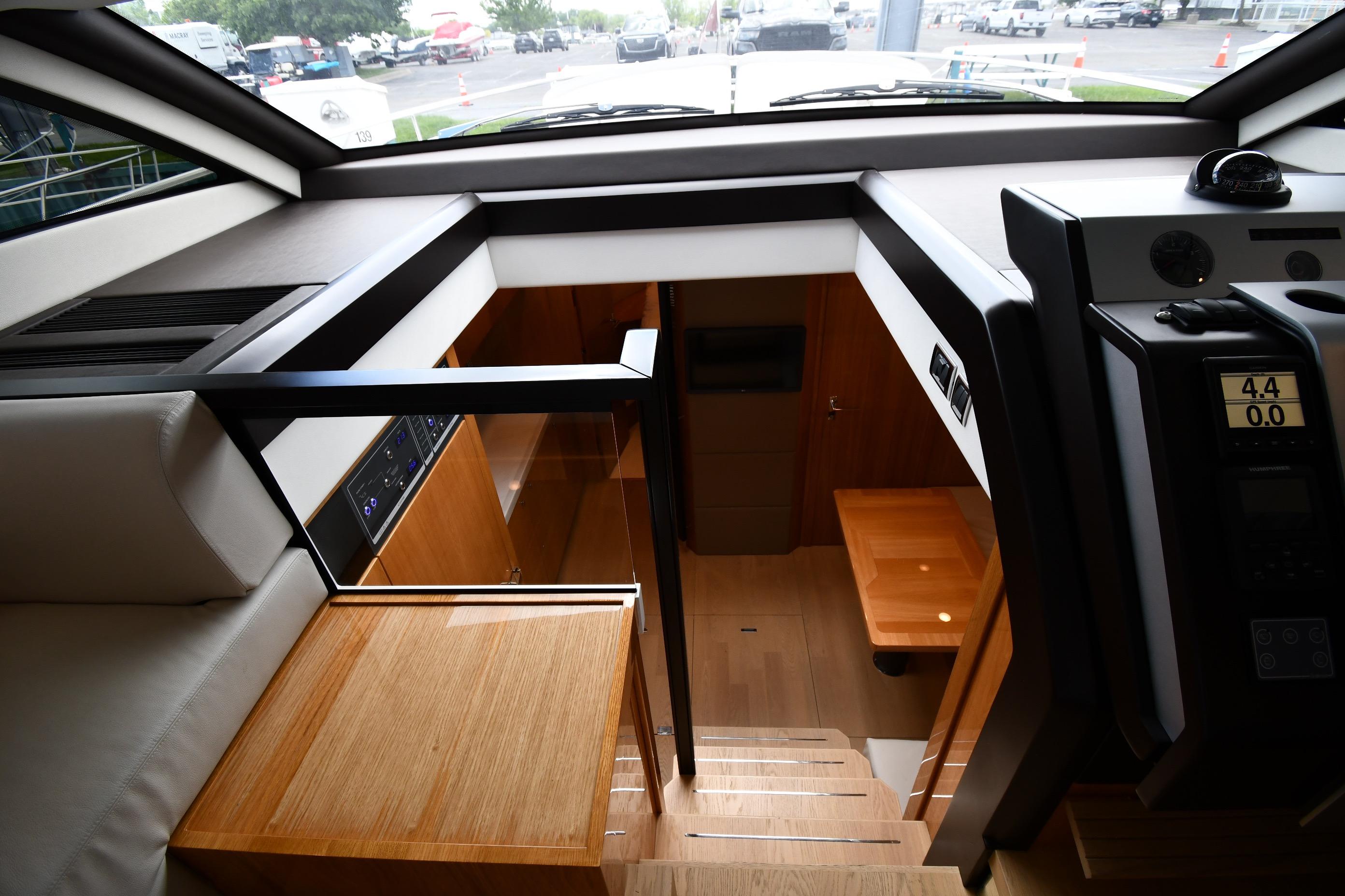 Interior view of 2024 Fairline G50 Targa yacht, showcasing modern design and wooden finishes.