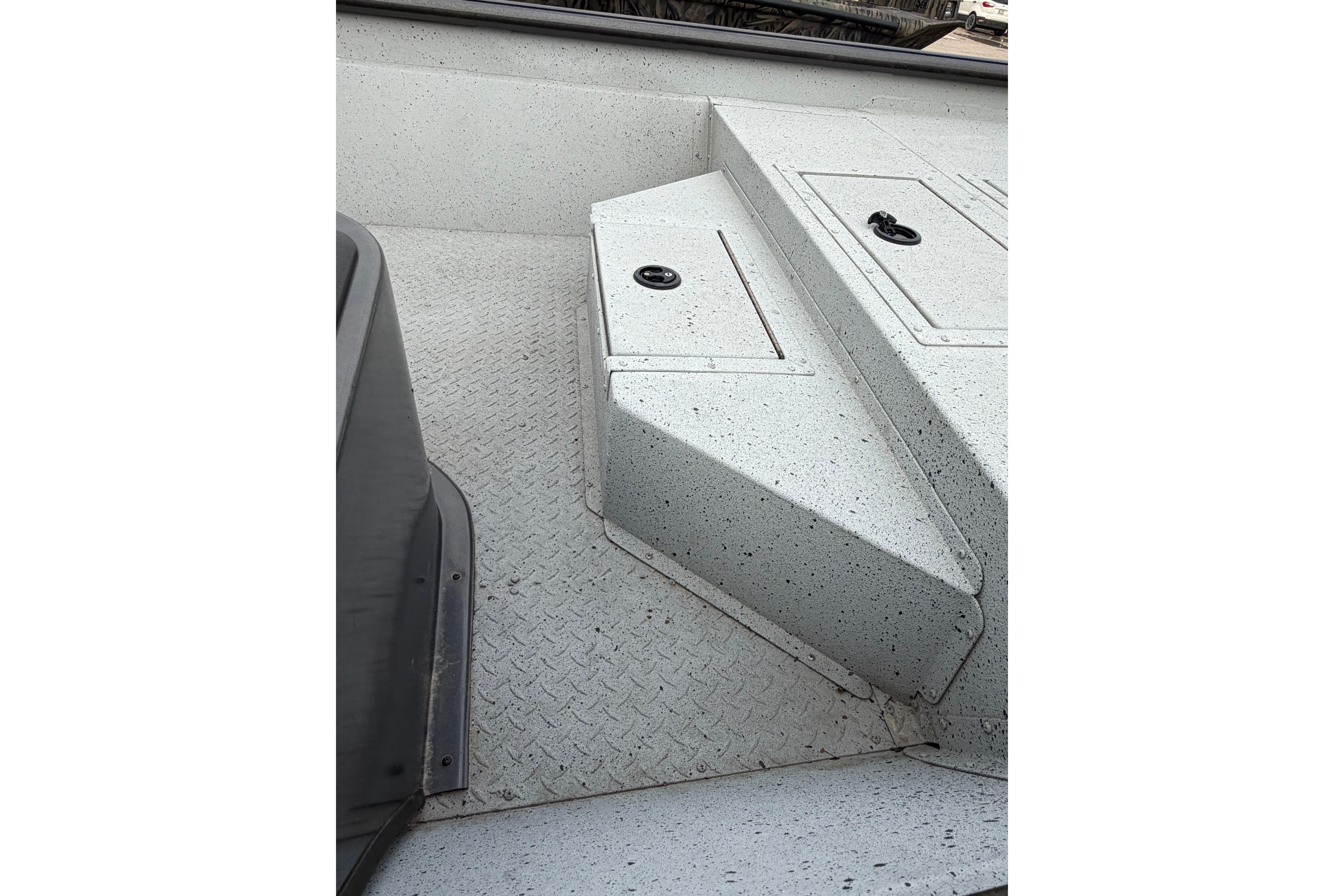 2023 SeaArk 180 RX boat interior with textured flooring and storage compartments.