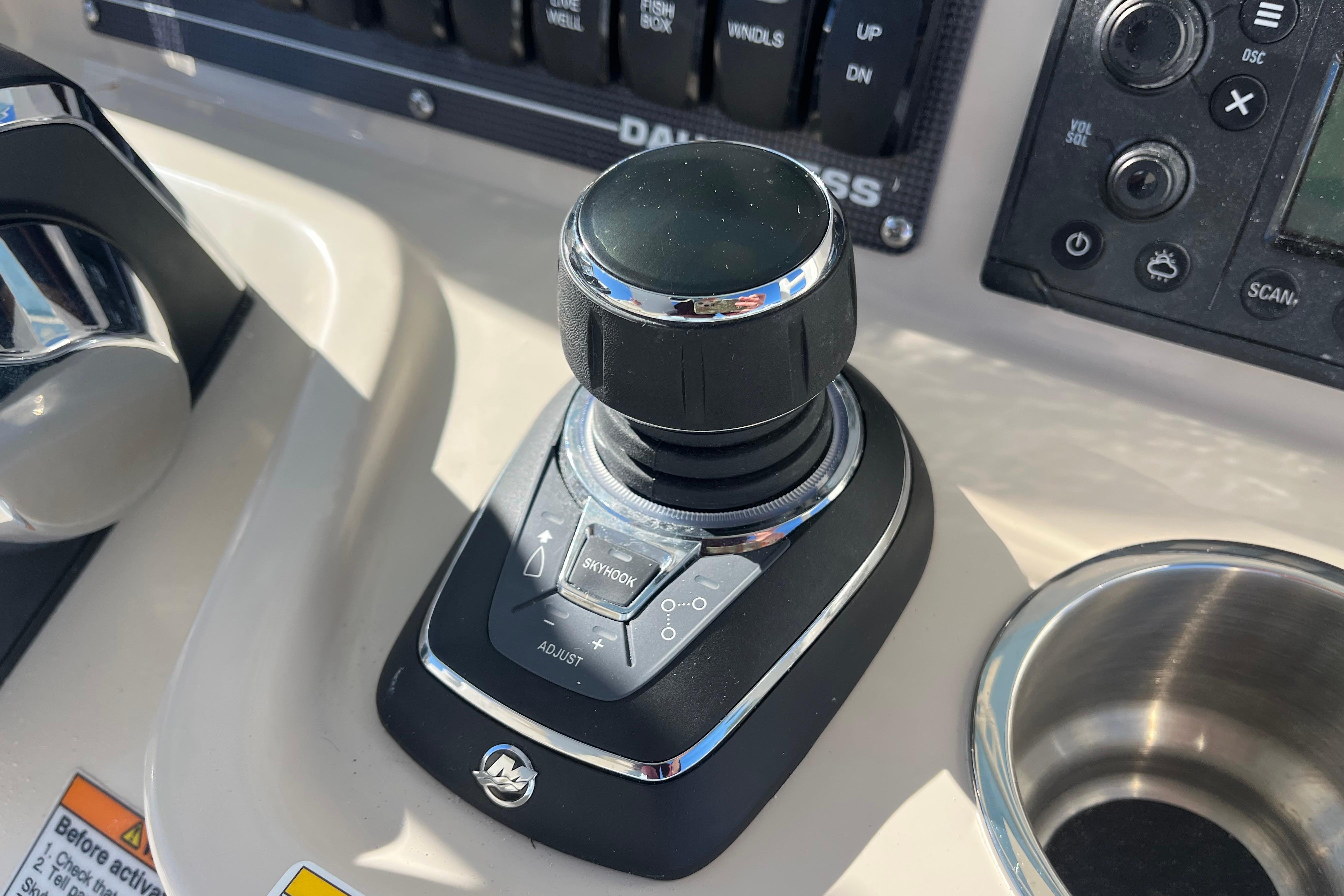 Control panel of 2026 Boston Whaler 280 Dauntless boat, featuring joystick and buttons.