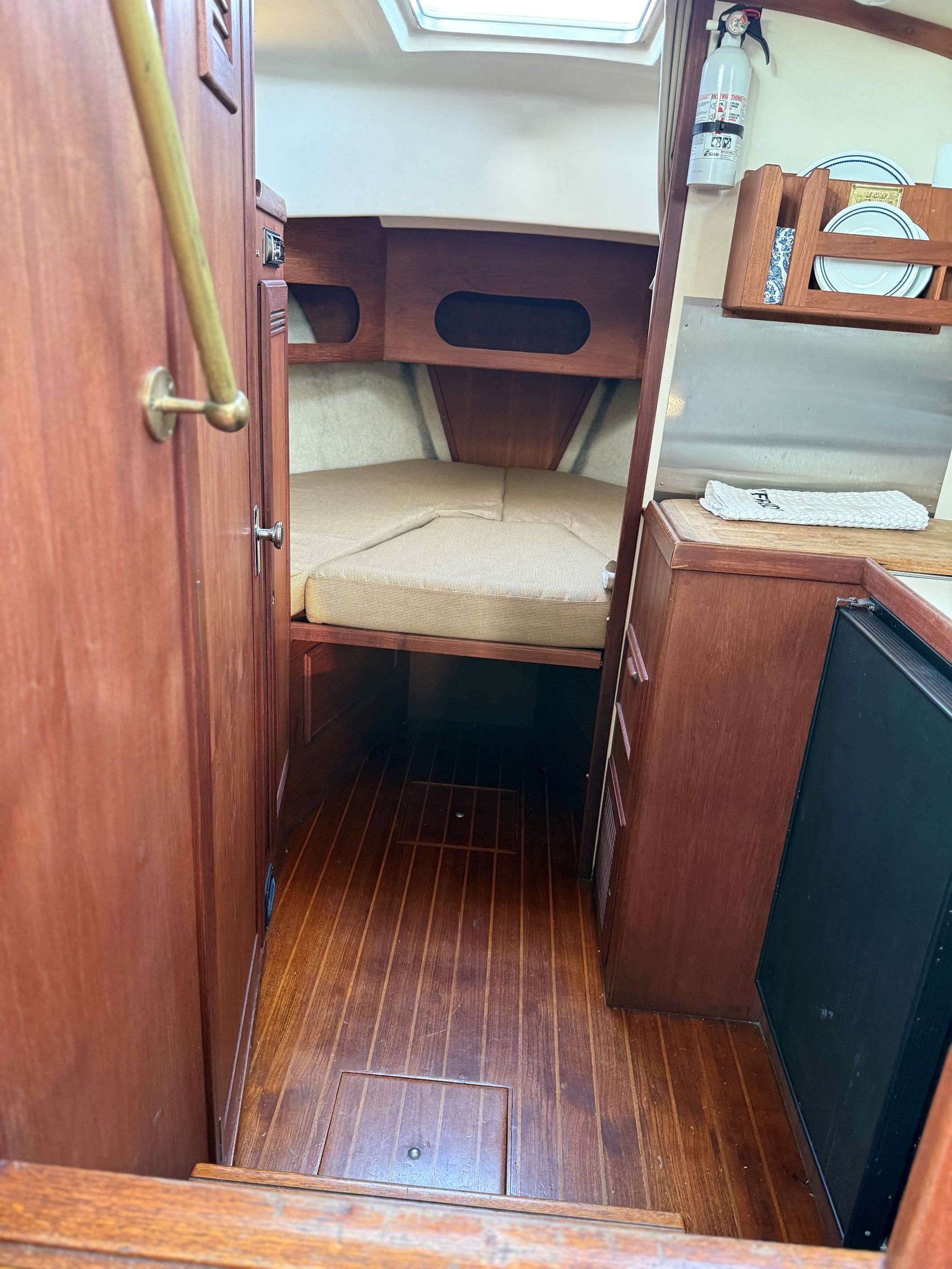 Interior of a 1987 Cape Dory 28 with wooden furnishings.