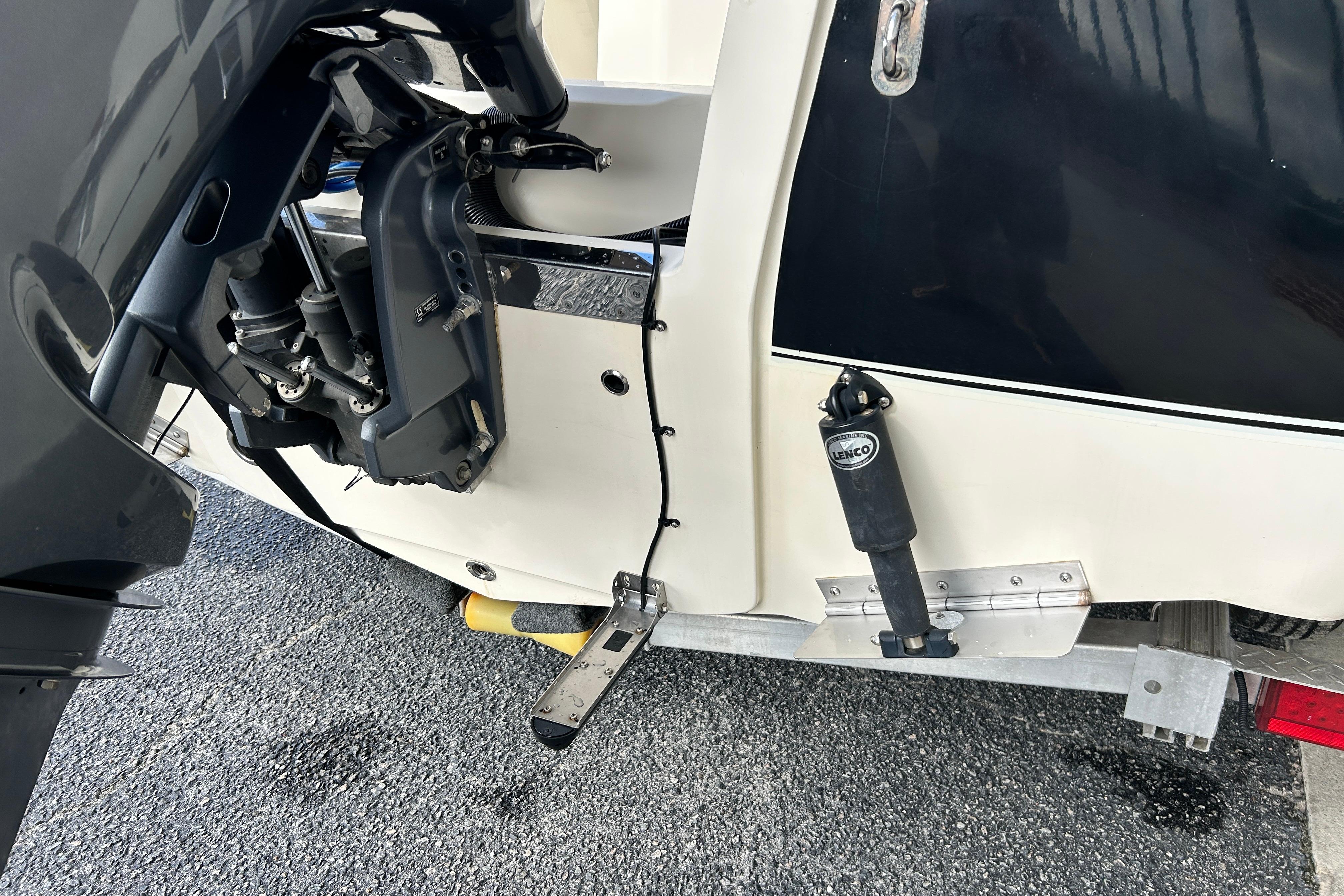 2020 Scout 195 Sportfish boat engine and trim tab detail.