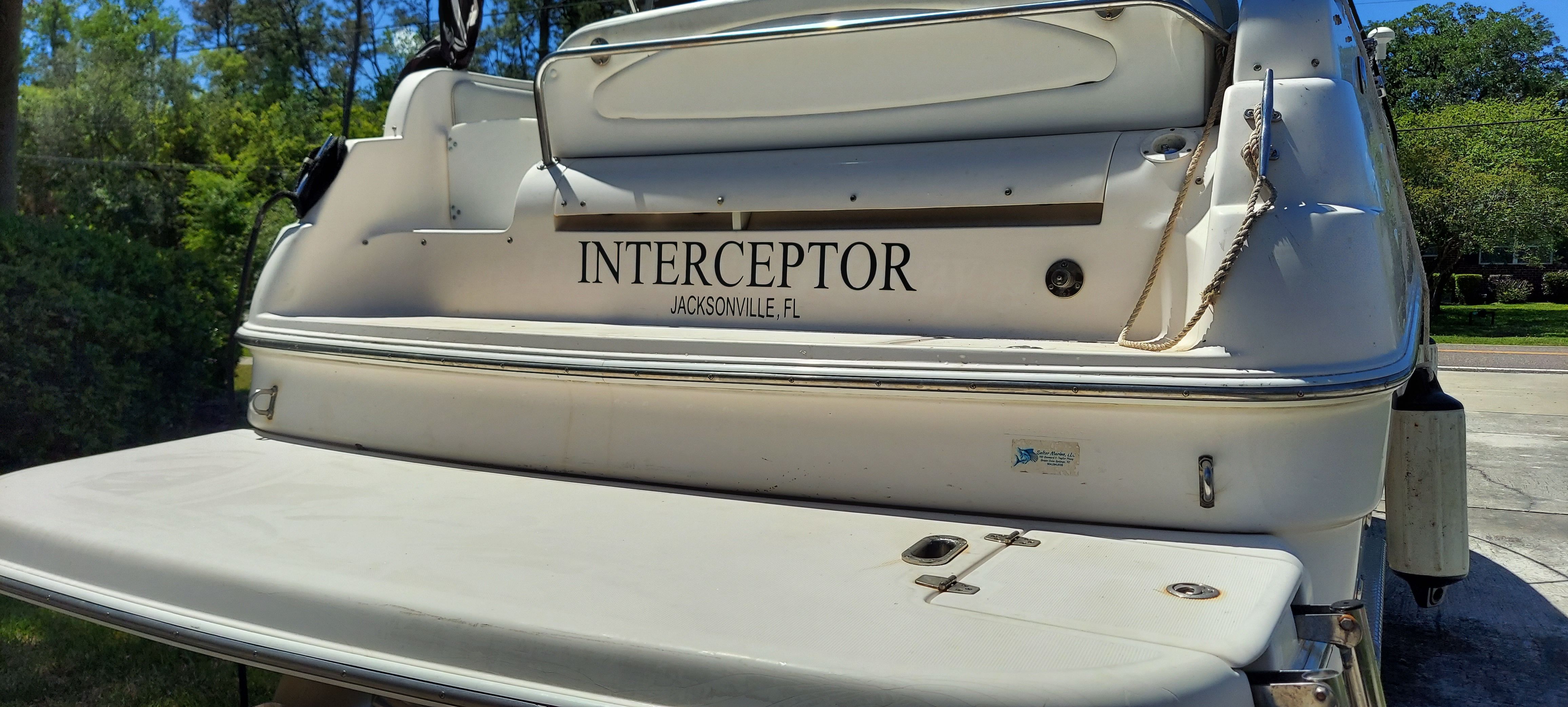 Rear view of a 2004 Regal Commodore 2465 boat named "Interceptor."