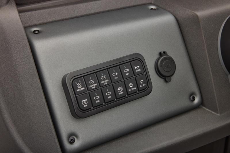 Control panel of 2026 Sun Tracker Party Barge 22 DLX with various switches and a power outlet.