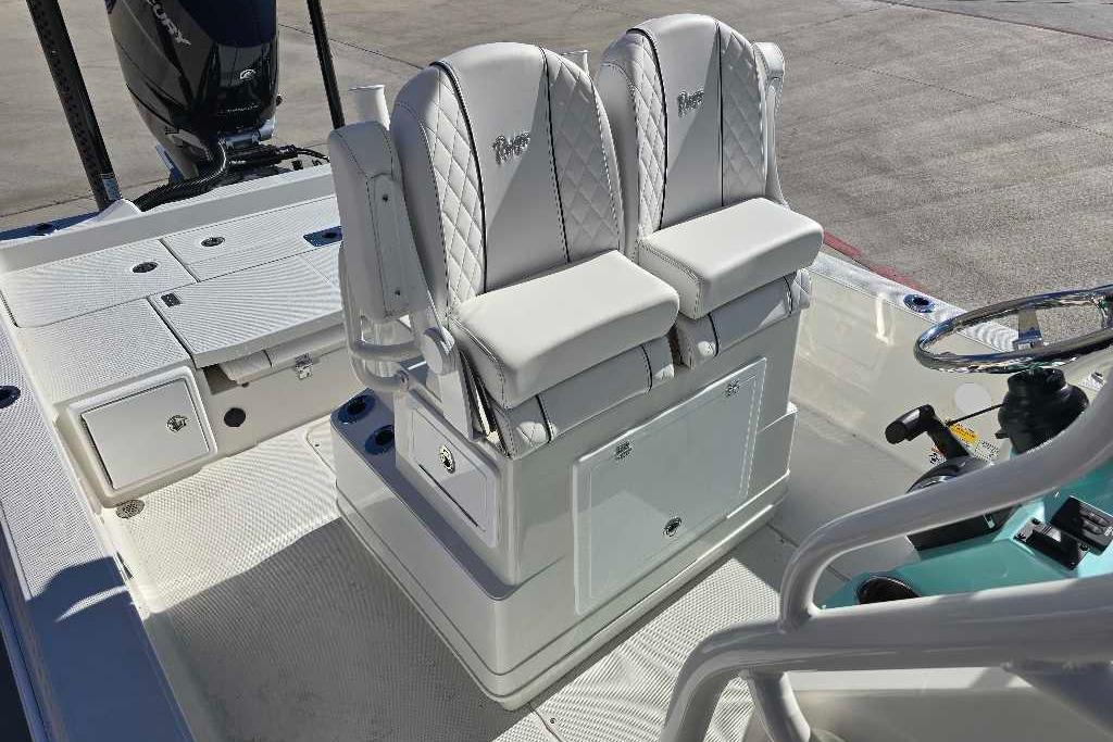2025 Ranger 2510 Bay boat interior with dual white cushioned seats and steering console.