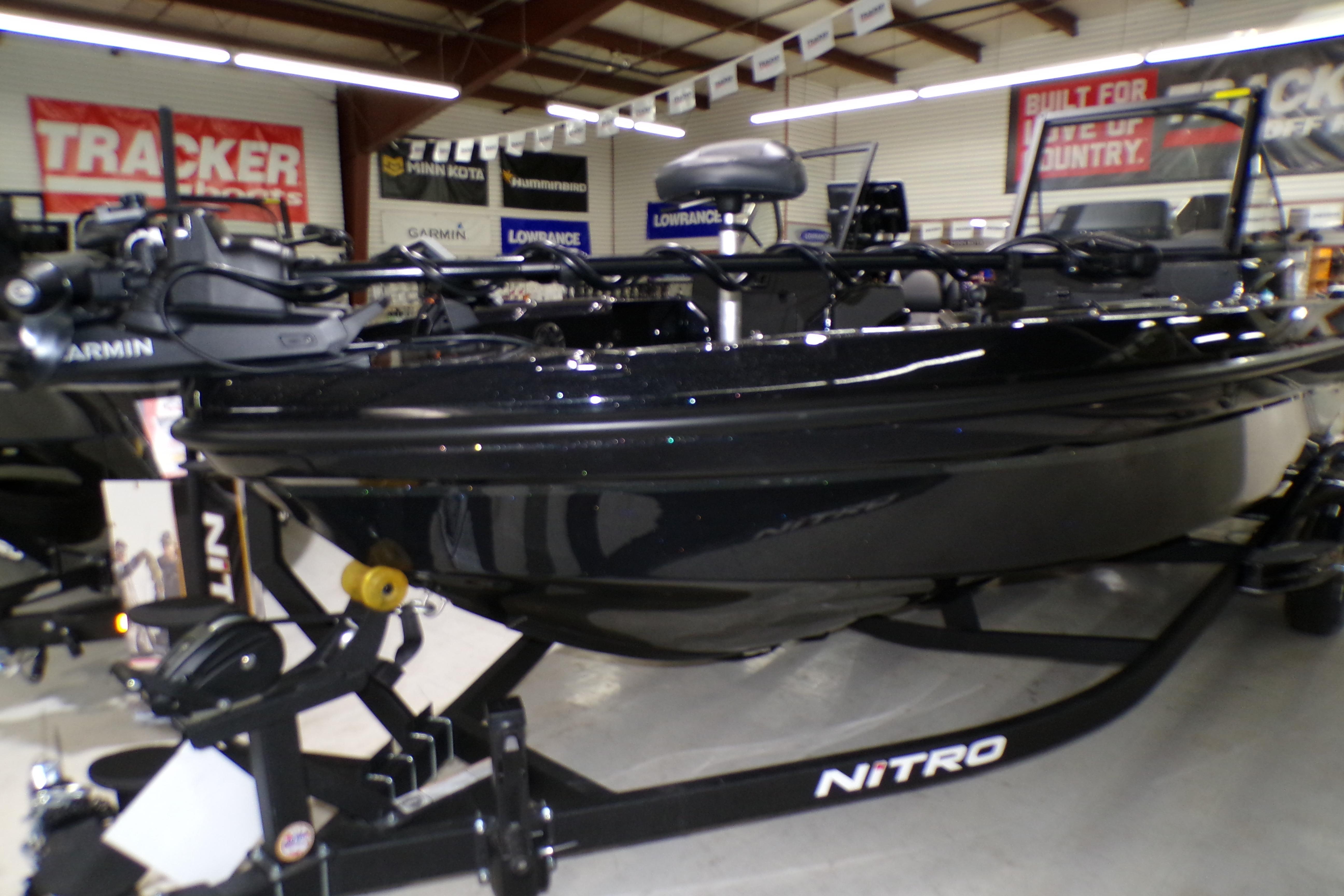 2026 Nitro ZV21 Pro boat displayed in showroom with advanced navigation equipment.