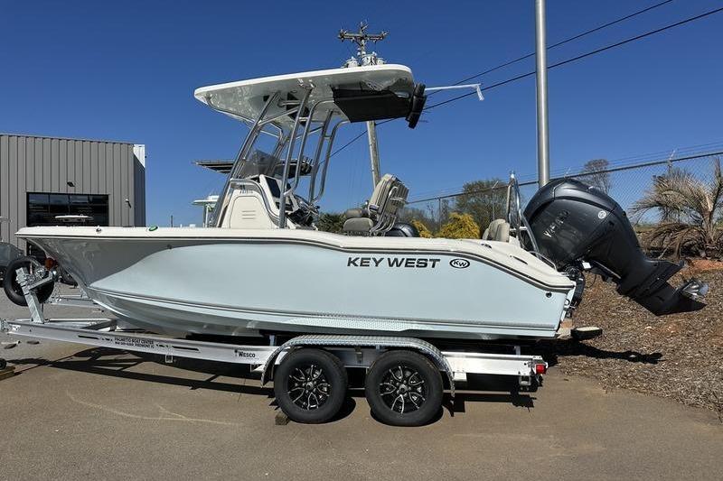 2026 Key West 219 FS boat on trailer, parked outdoors, side view.