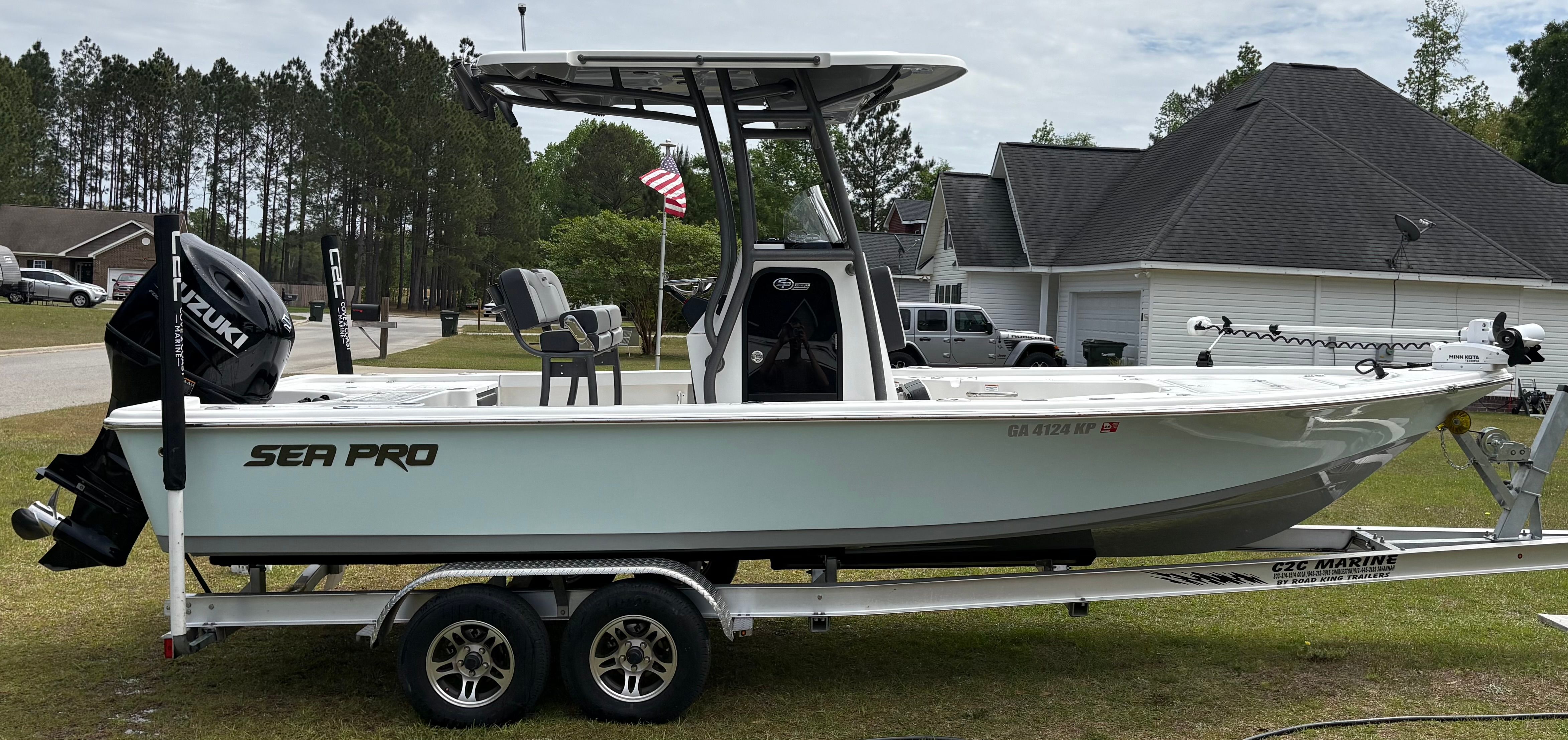 2025 Sea Pro 230 Bay boat parked on trailer outdoors.