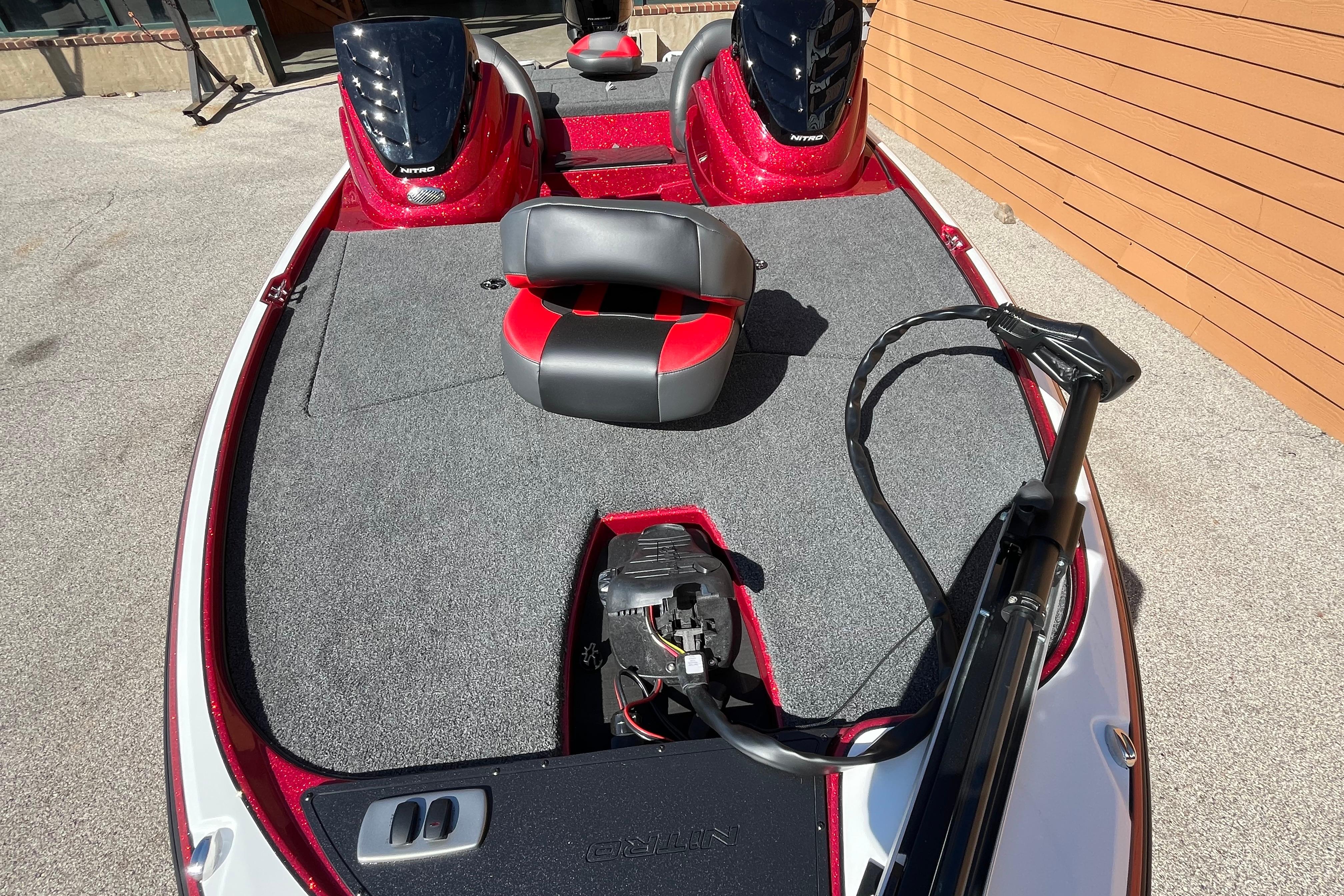 2026 Nitro Z17 boat with red accents and seating on a sunny day.