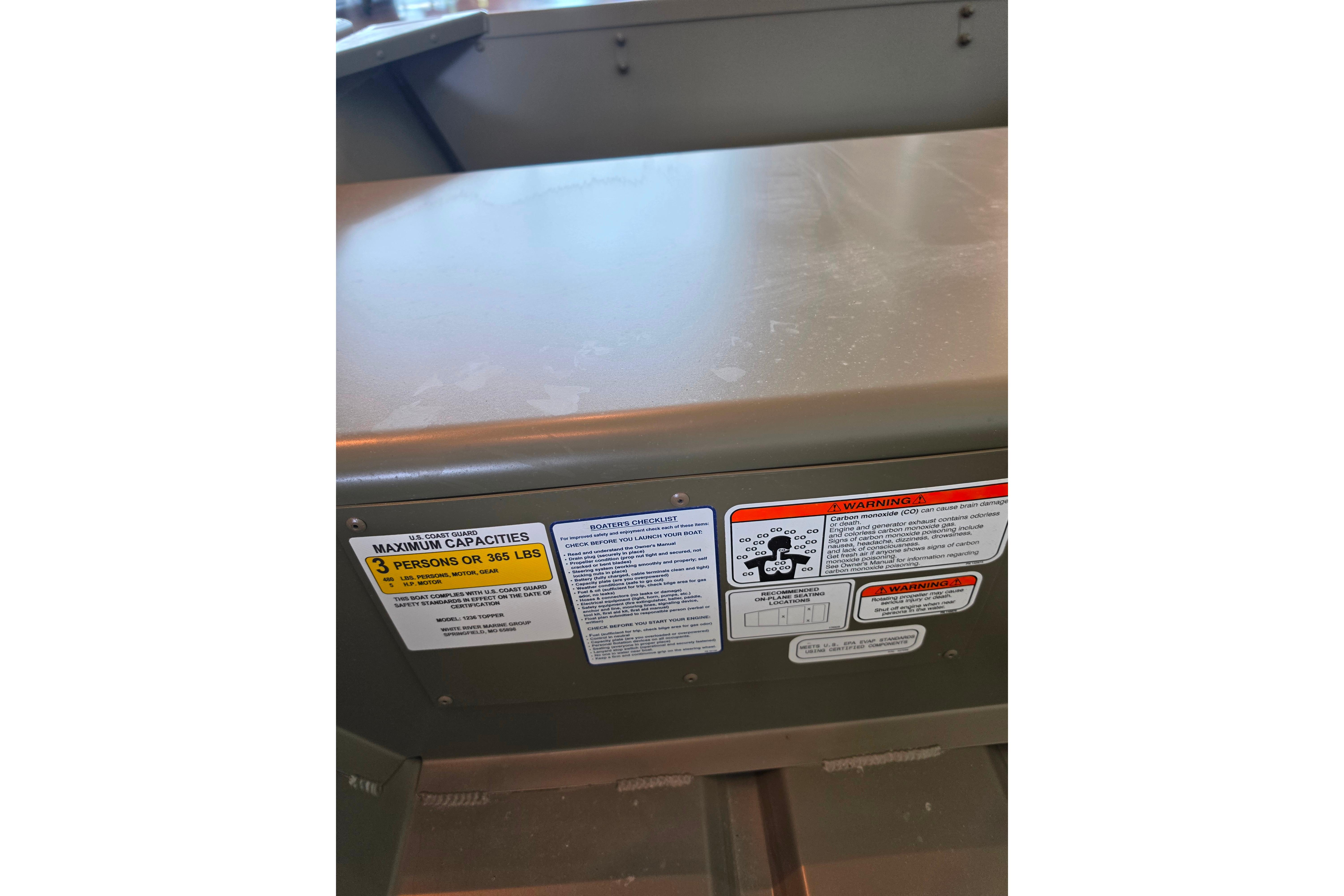 2026 Tracker Grizzly 12 Jon boat capacity and safety labels, maximum 3 persons or 365 lbs.