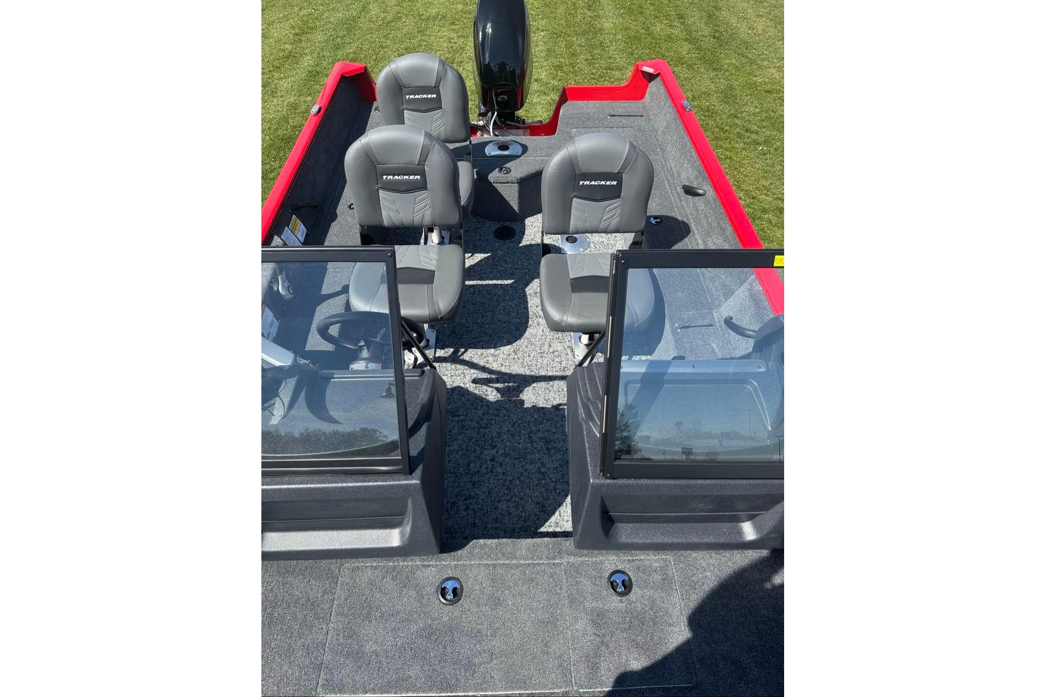 2026 Tracker Pro Guide V-16 WT boat interior with four seats and dual windshields.