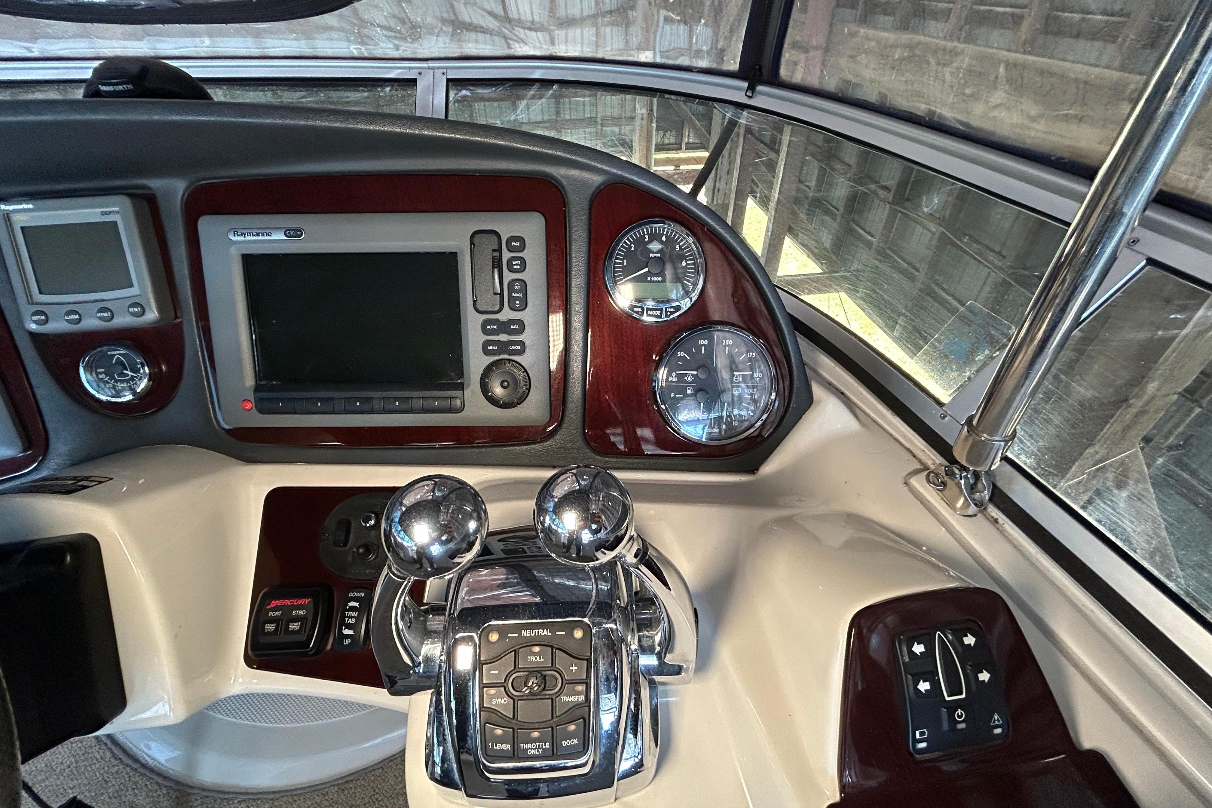 Control panel of a 2009 Meridian 391 Sedan yacht with navigation instruments.