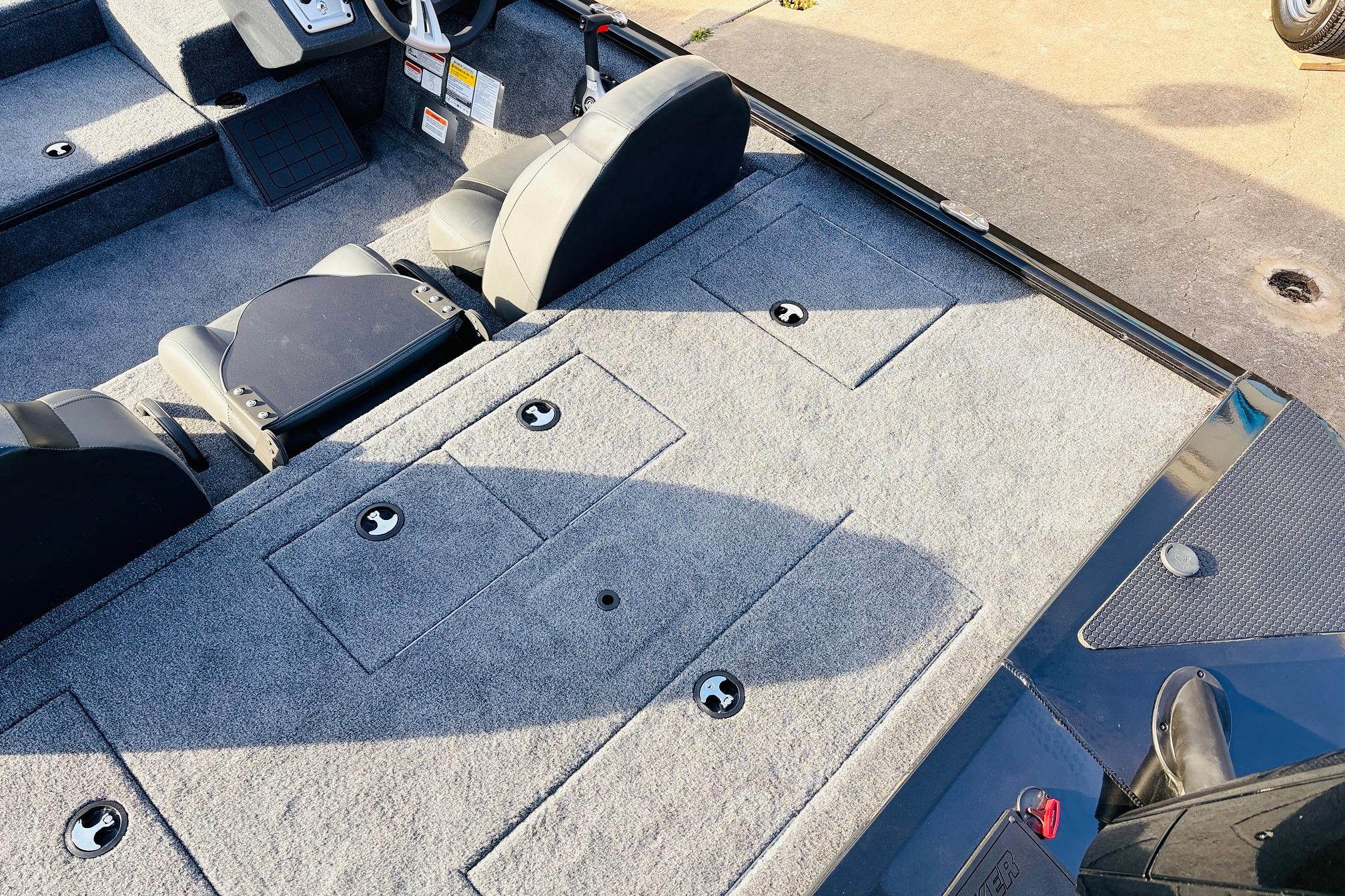 2025 Tracker Savage 215 boat interior with gray carpet and seating.