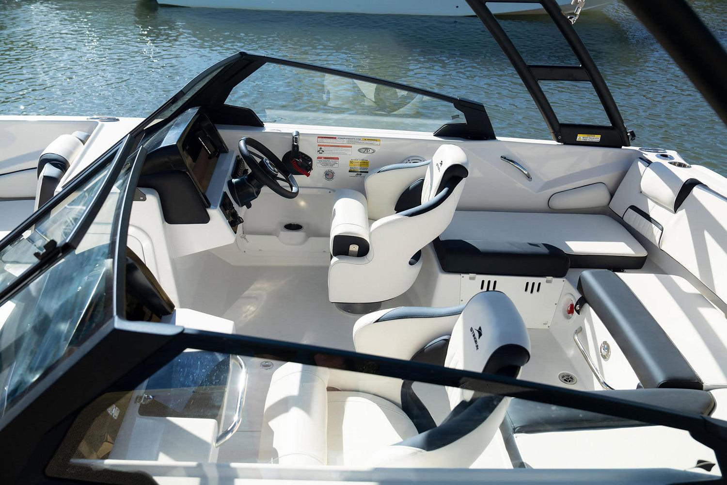 Manufacturer Provided Image: 2026 Stingray 20 SBX boat interior with modern seating and steering wheel.