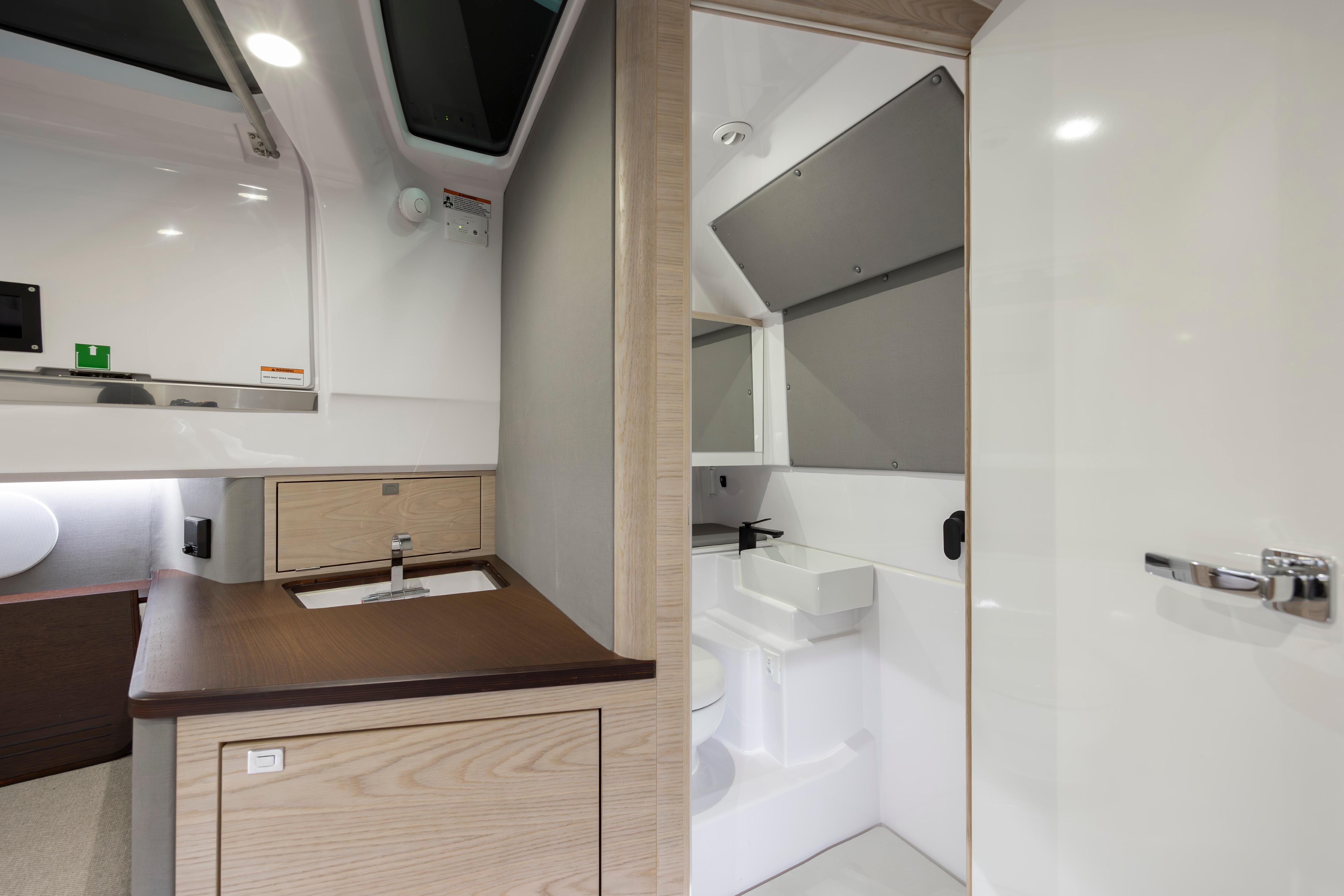 Luxurious bathroom interior of 2027 Axopar 45 XC Cross Cabin boat.
