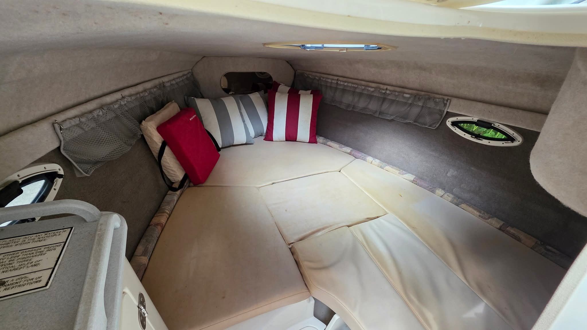 Interior of the 2006 Stingray 250 CR with cozy cushions and upholstery.