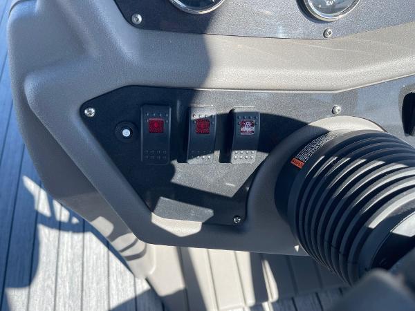 Control panel of 2025 Armada Saphir 23CR boat with switches and dials.