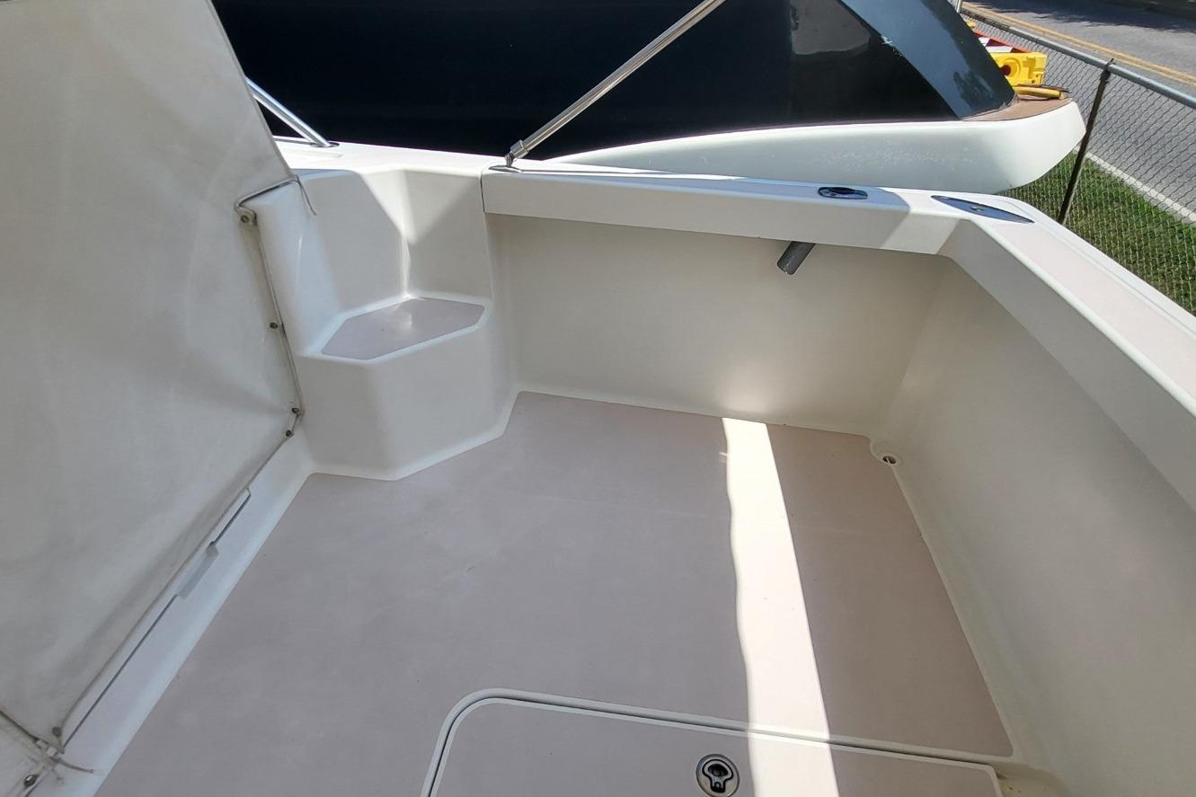 2006 Back Cove 29 boat deck with seating and storage area.