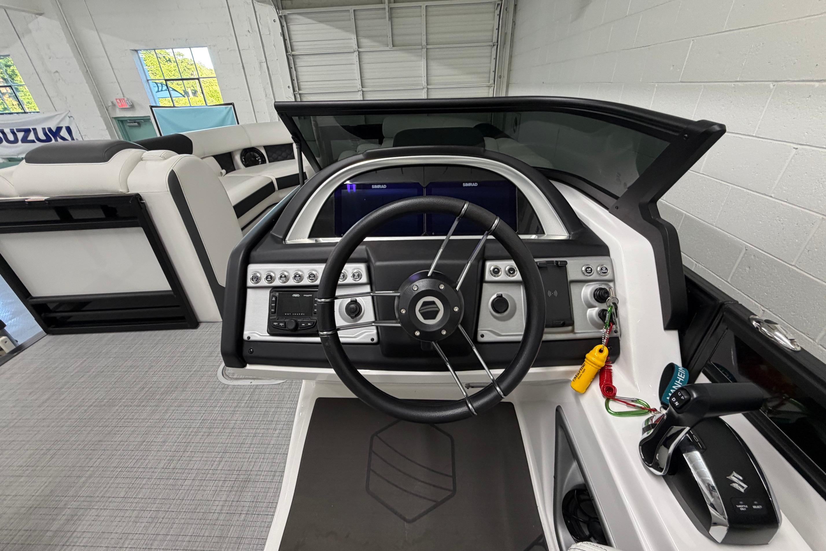 Interior view of 2026 South Bay 525SB2 boat cockpit with modern steering and controls.