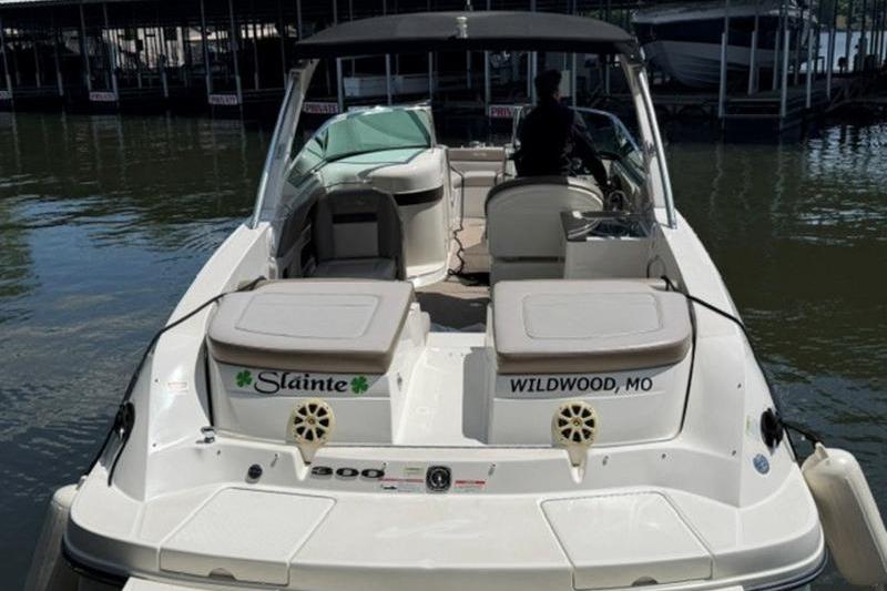 2011 Sea Ray 300 SLX boat docked, rear view, with "Slainte" and "Wildwood, MO" text.