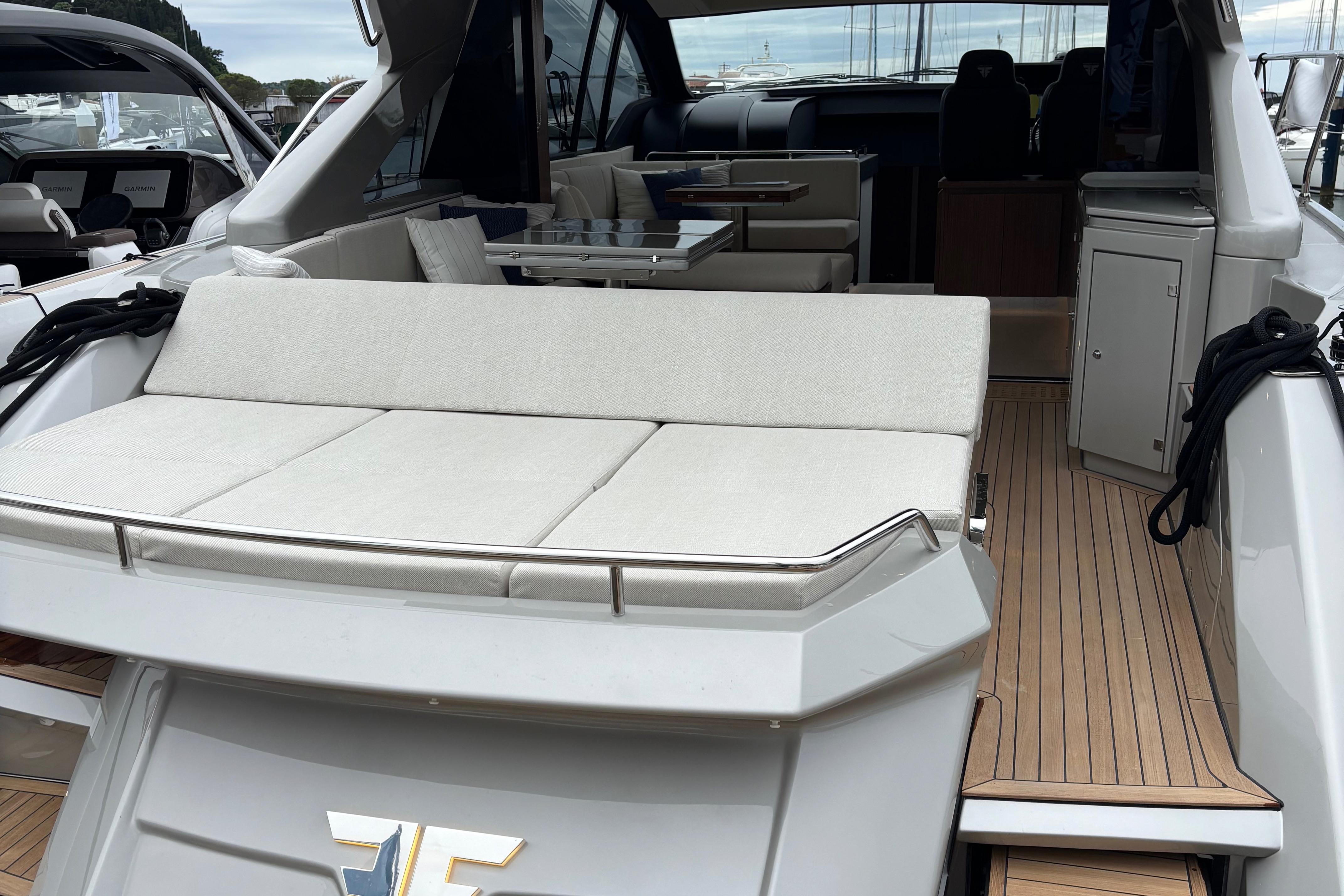 Luxury 2025 Filippetti S55 yacht with spacious deck and elegant interior seating.
