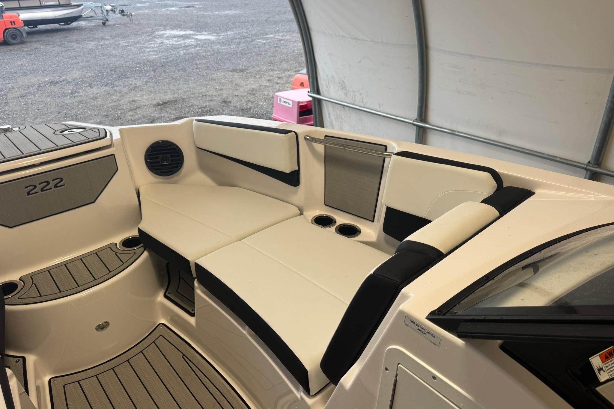 2026 Yamaha Boats 222SD interior seating with cup holders and sleek design.