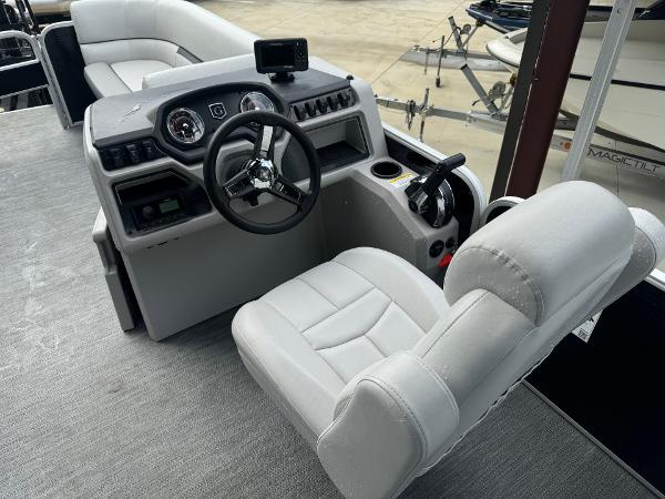 2023 Godfrey 2286 boat interior with captain's chair and control console.