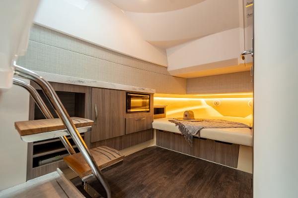 Manufacturer Provided Image: Luxurious interior of 2026 Regal 38 SAV yacht with modern amenities and cozy sleeping area.