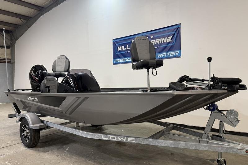 2026 Lowe Skorpion 16 fishing boat on trailer in showroom setting.