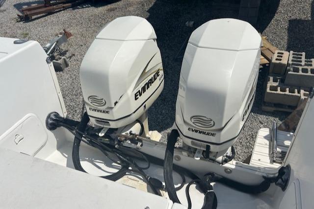 Twin Evinrude outboard motors on a 2001 Seaswirl Striper 2601 Walkaround boat.