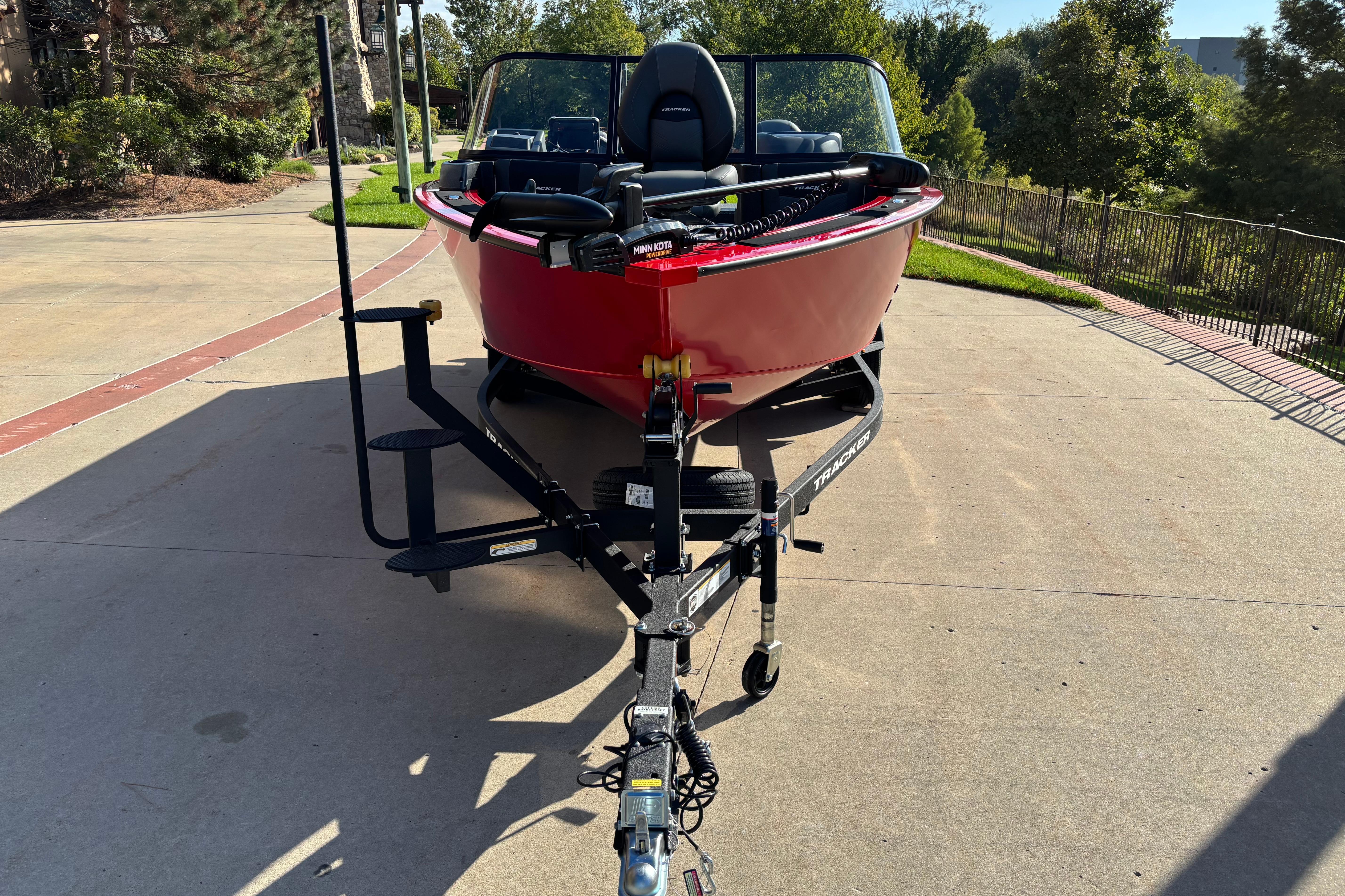 2026 Tracker Targa V-19 Combo boat on trailer, parked on driveway.