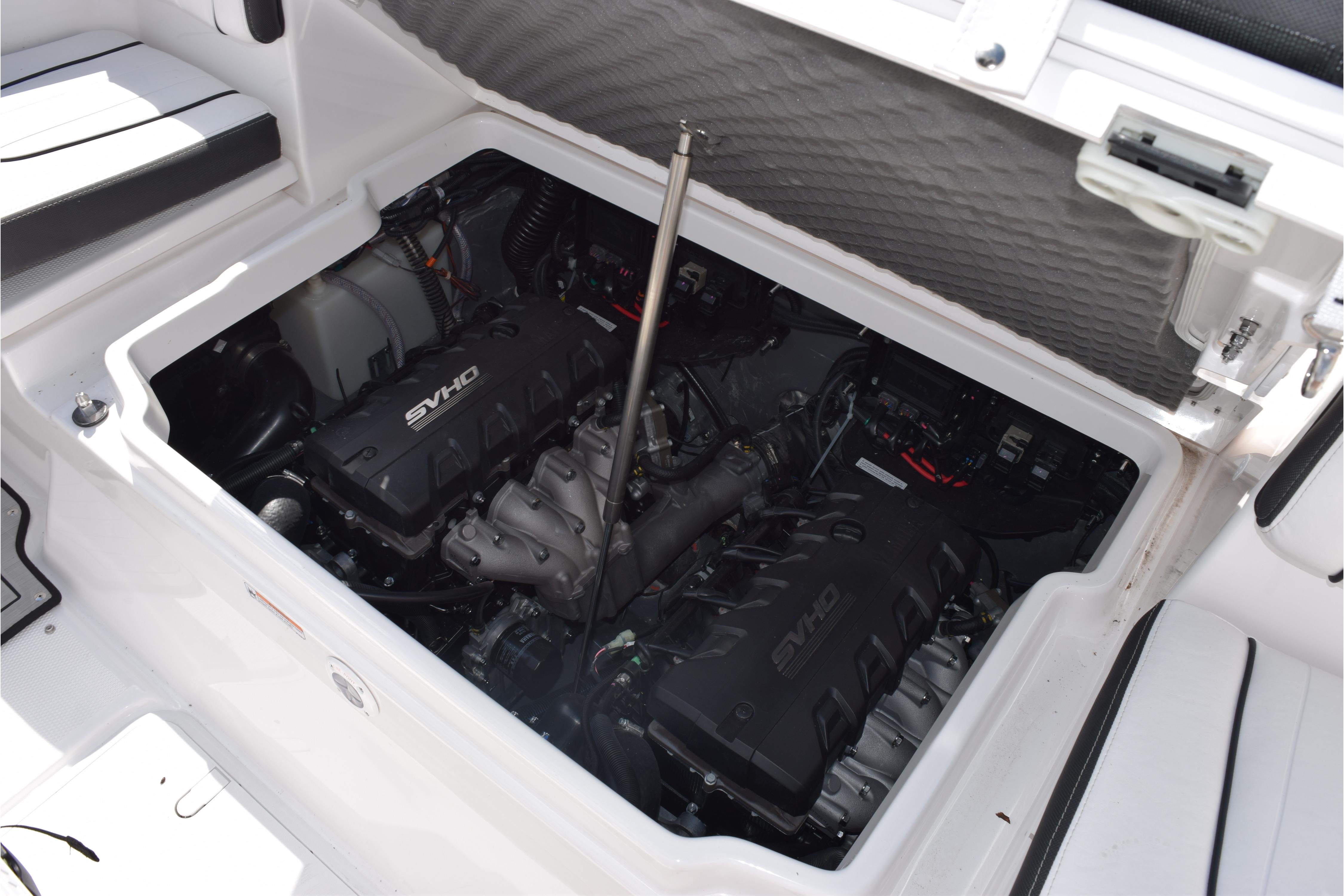 Engine compartment of 2026 Yamaha Boats 255 FSH Sport H, featuring dual SVHO engines.